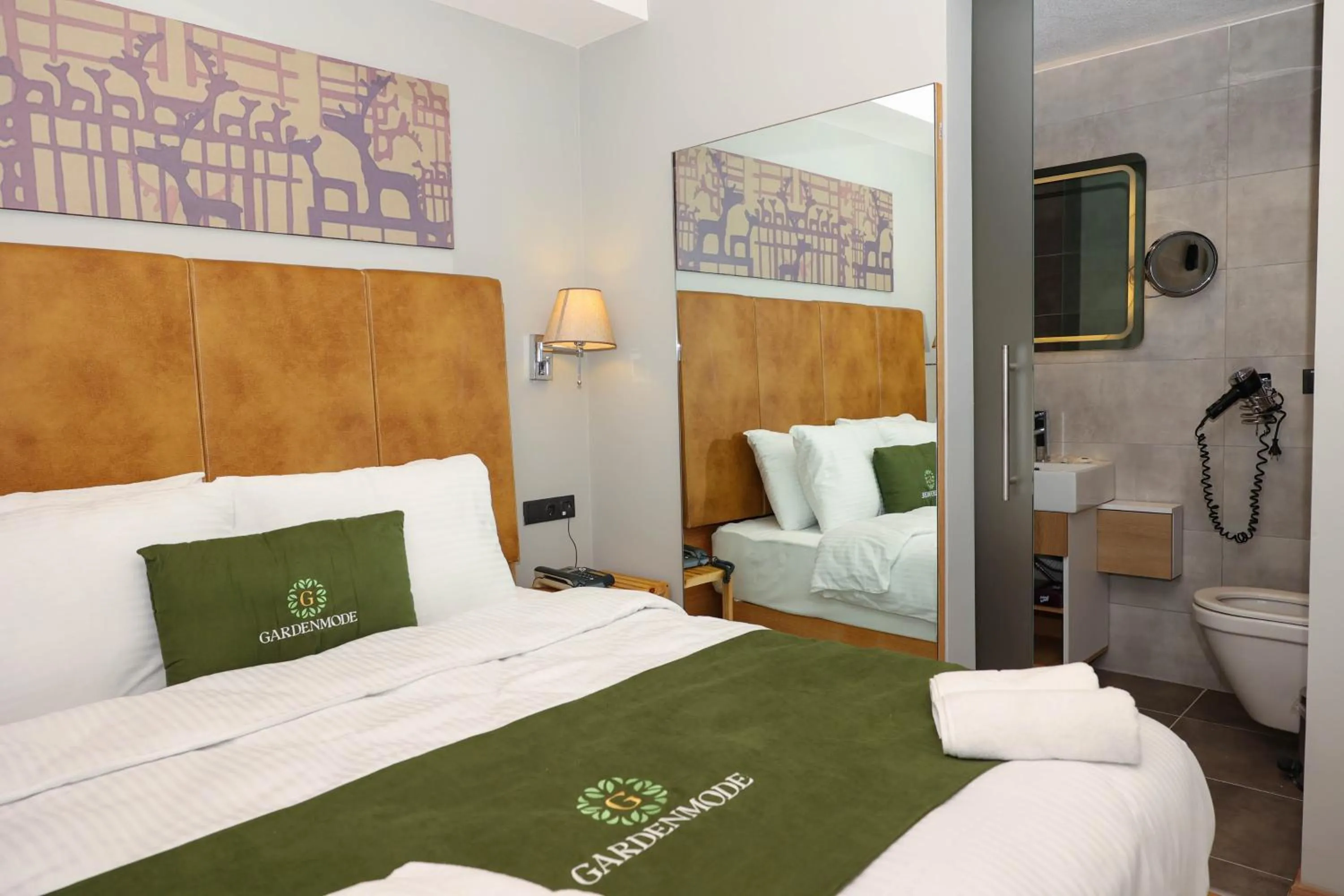 Bed in Gardenmode Airport Hotel