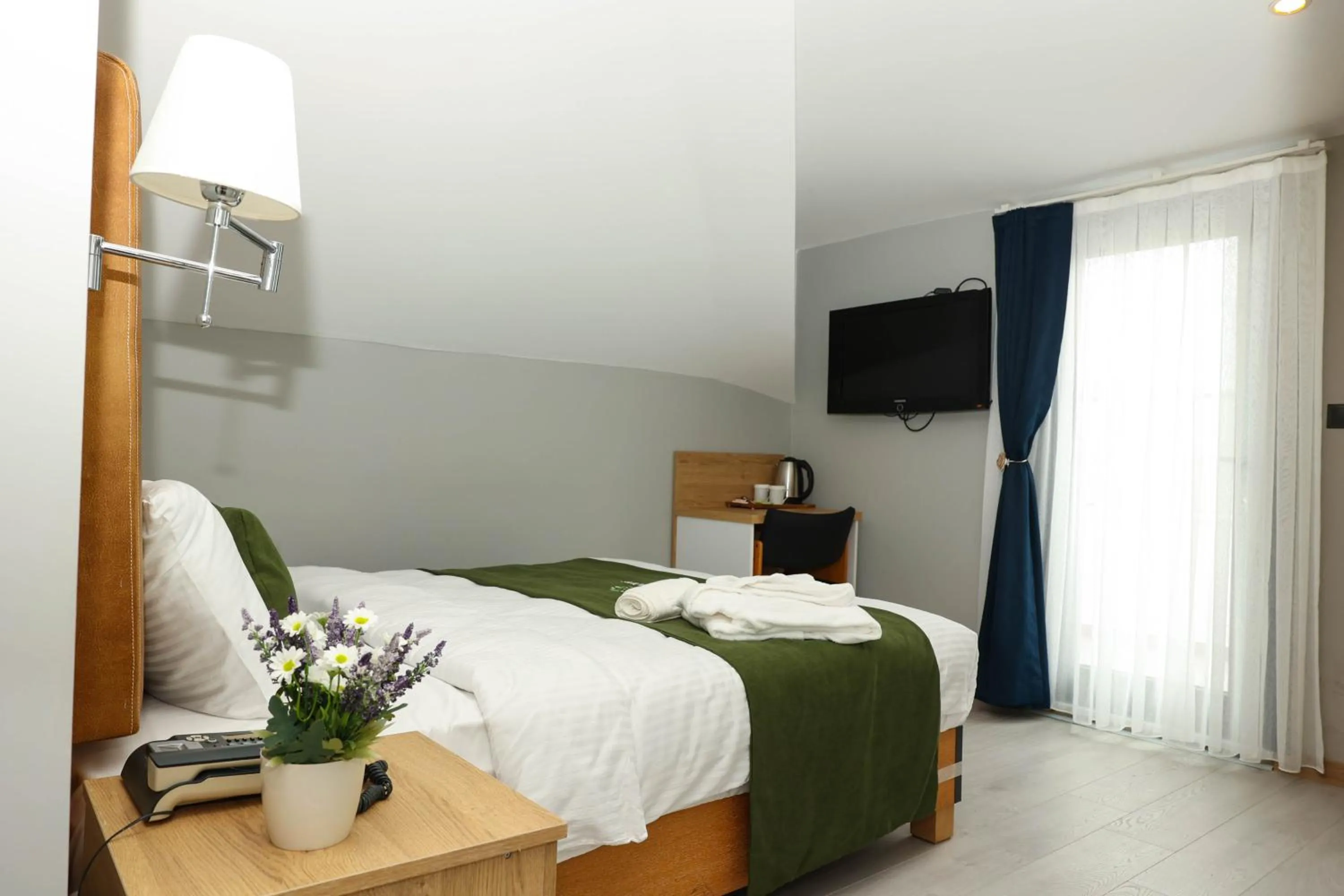 Bed in Gardenmode Airport Hotel