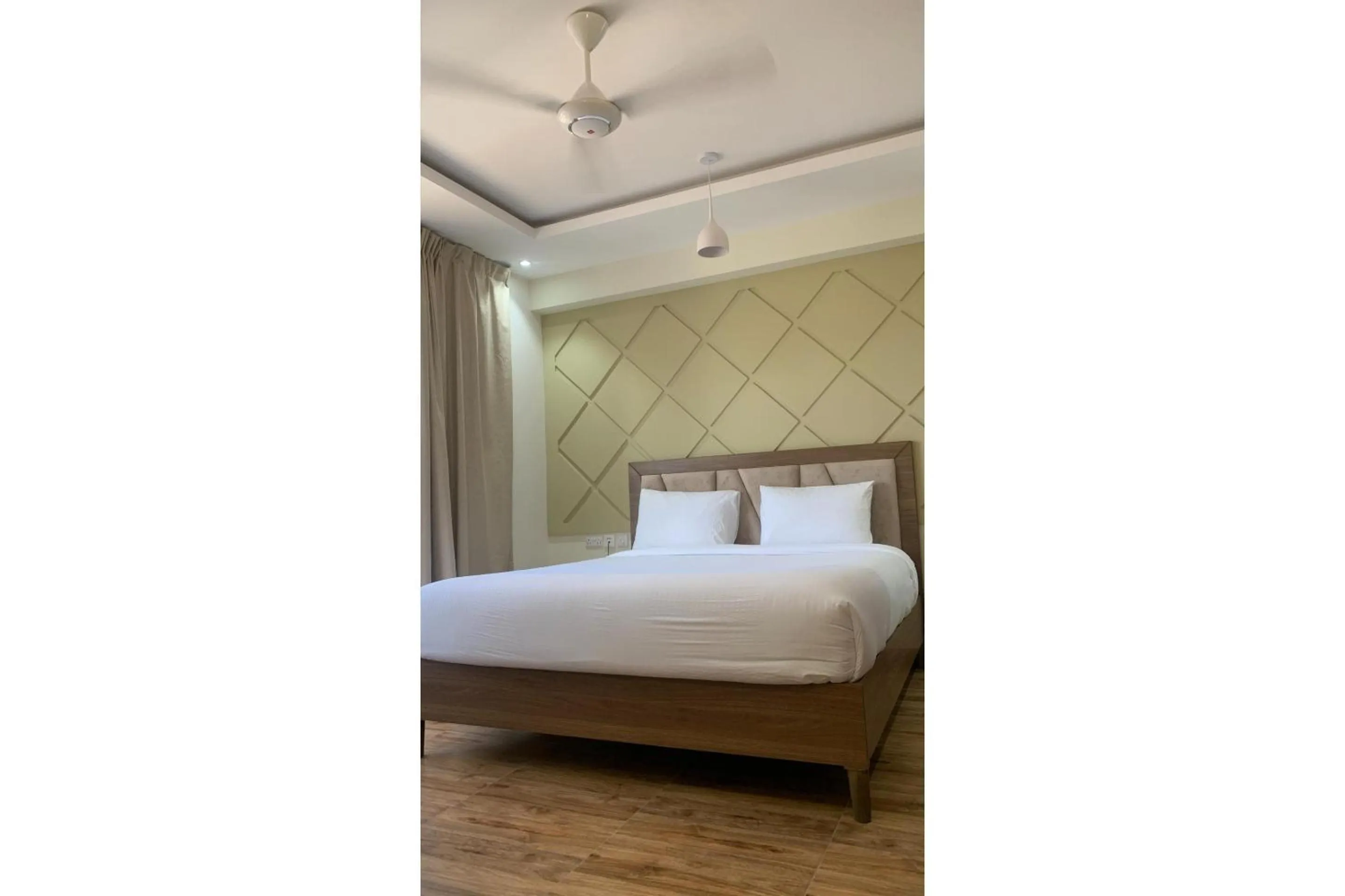 Bedroom, Bed in OYO Townhouse 156 Rose Hotel Apartments