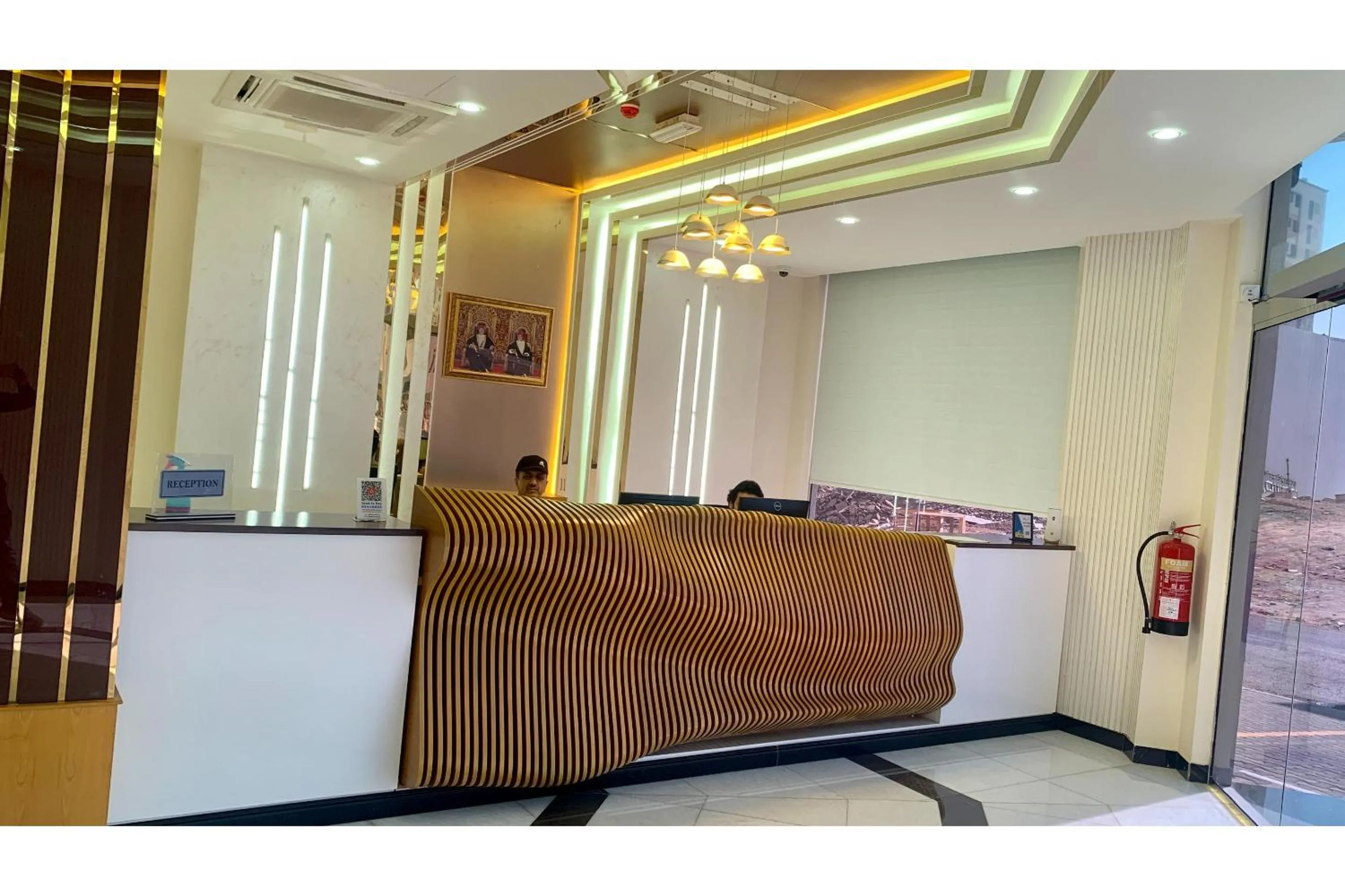 Lobby or reception in OYO Townhouse 156 Rose Hotel Apartments