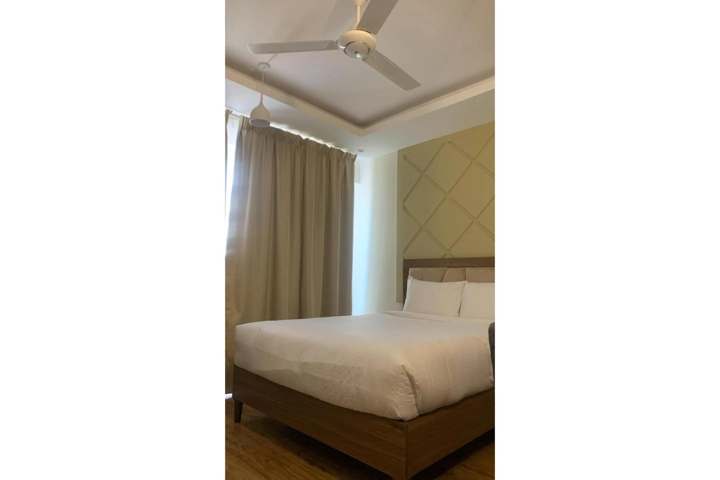 Bedroom, Bed in OYO Townhouse 156 Rose Hotel Apartments