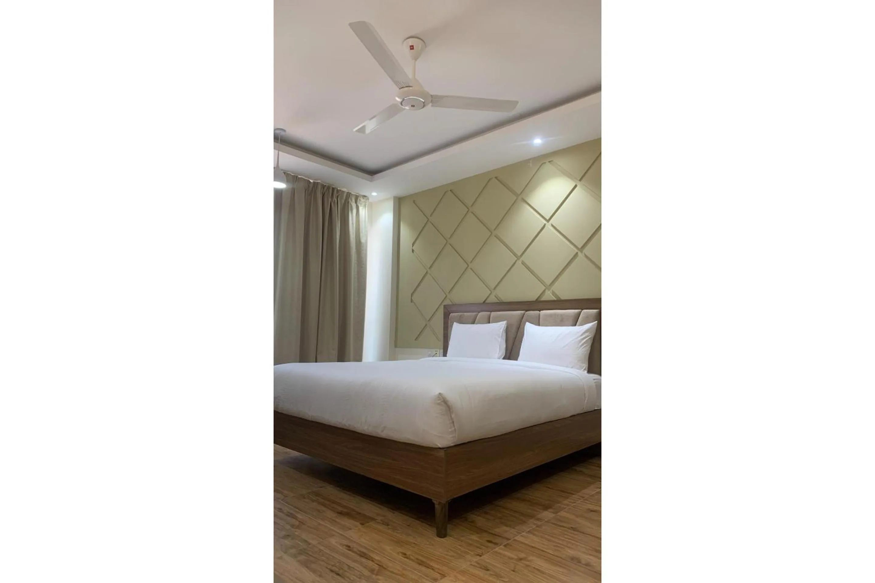Bedroom, Bed in OYO Townhouse 156 Rose Hotel Apartments