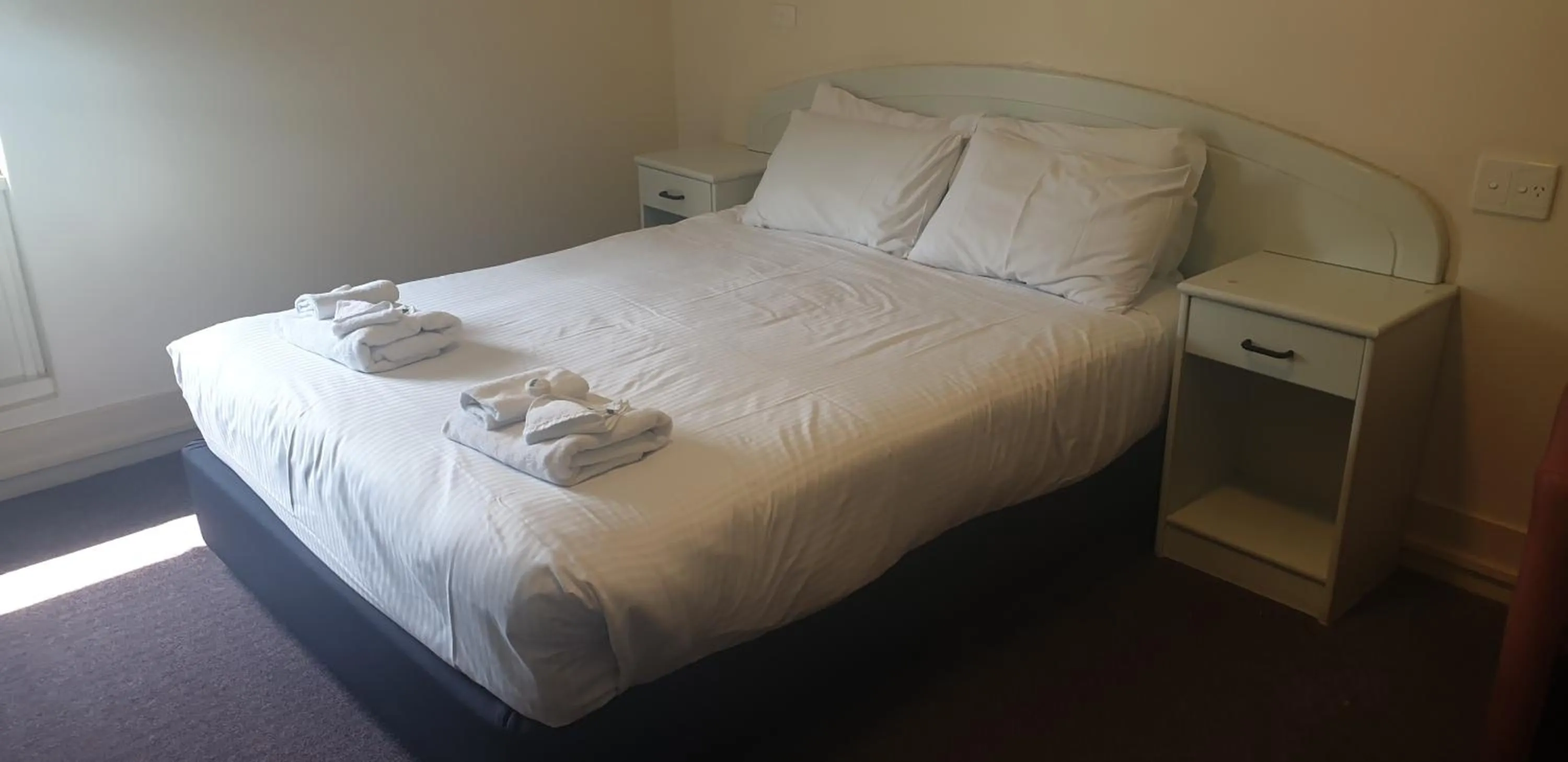 Bed in Grand Tasman Hotel