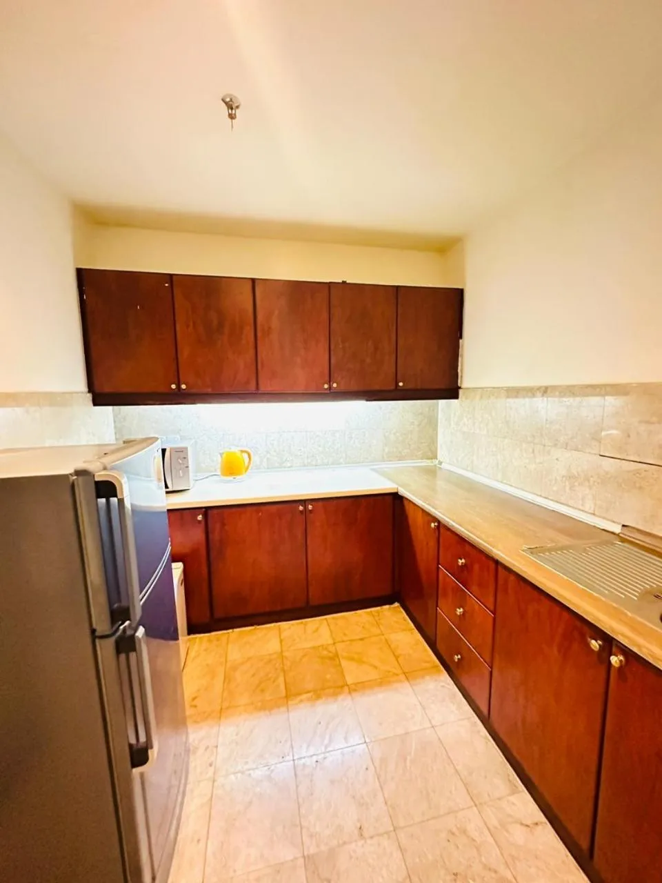 Kitchen or kitchenette in KL COZY GOLD SUITE At TIMES SQUARE