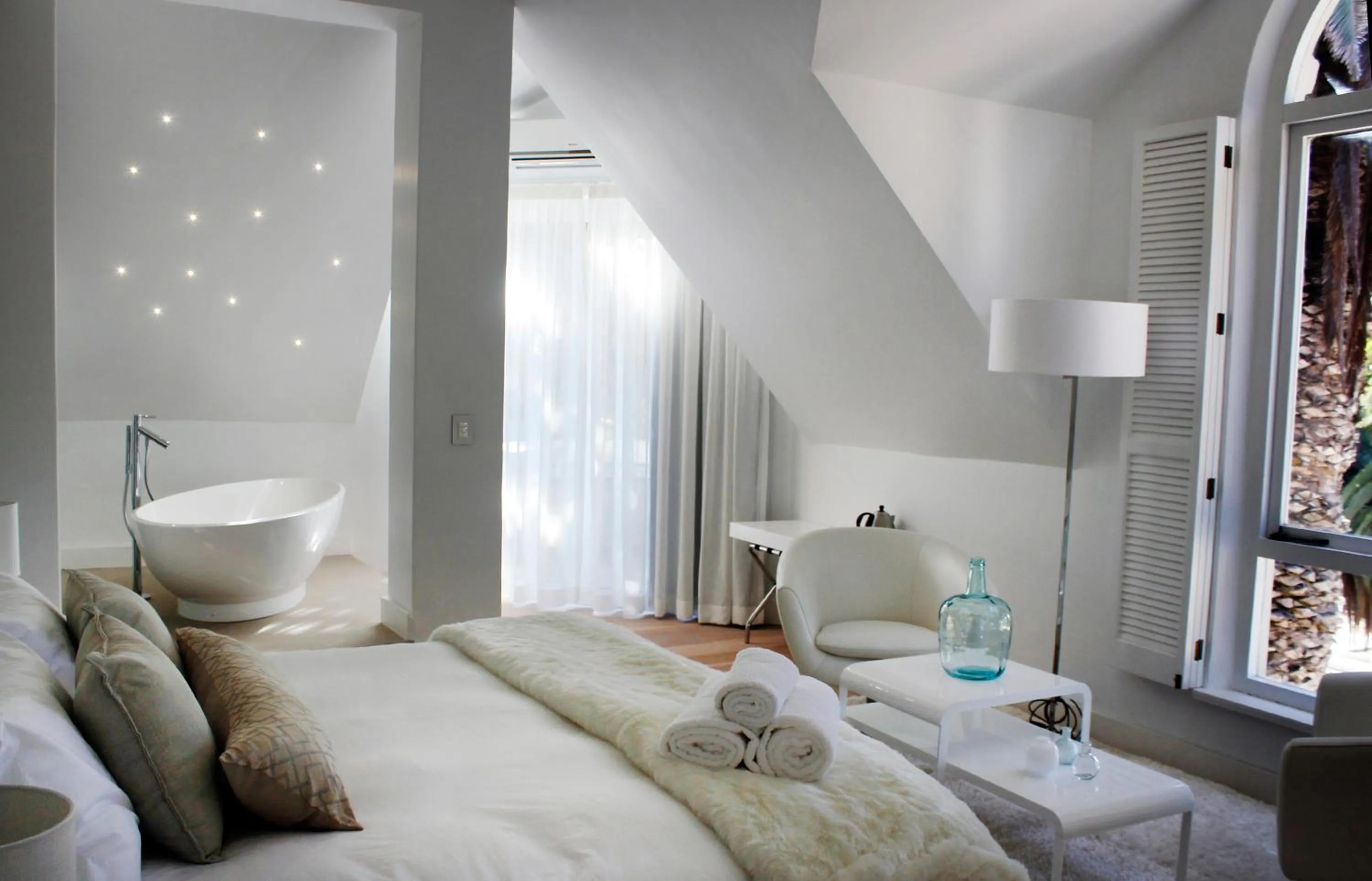 Seating area, Bed in Swakopmund Luxury Suites