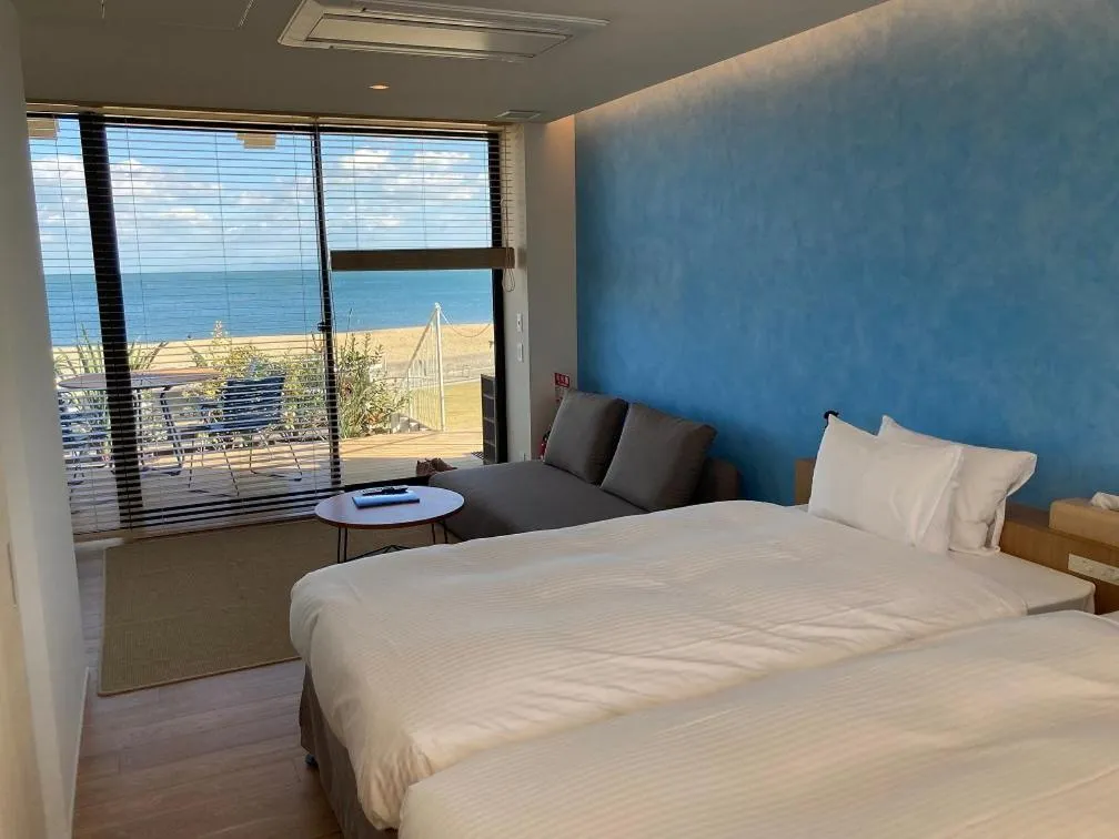 Bed in そらすな Beach Side Resort Hotel