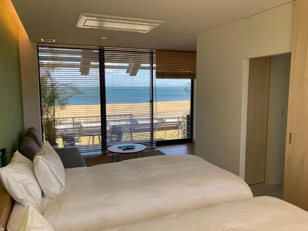 Bed in そらすな Beach Side Resort Hotel