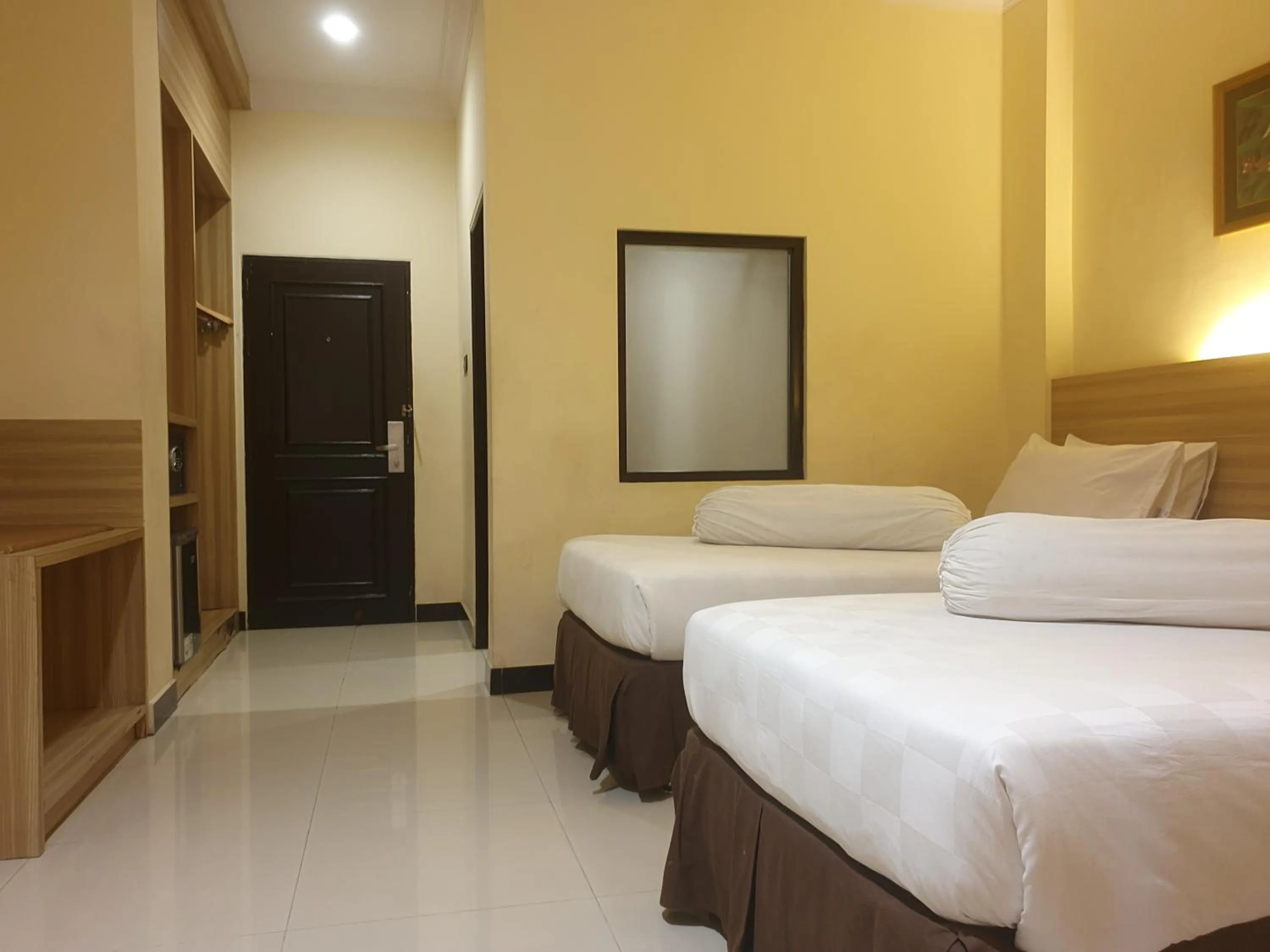 Bed in Violand Garden Hotel Samarinda