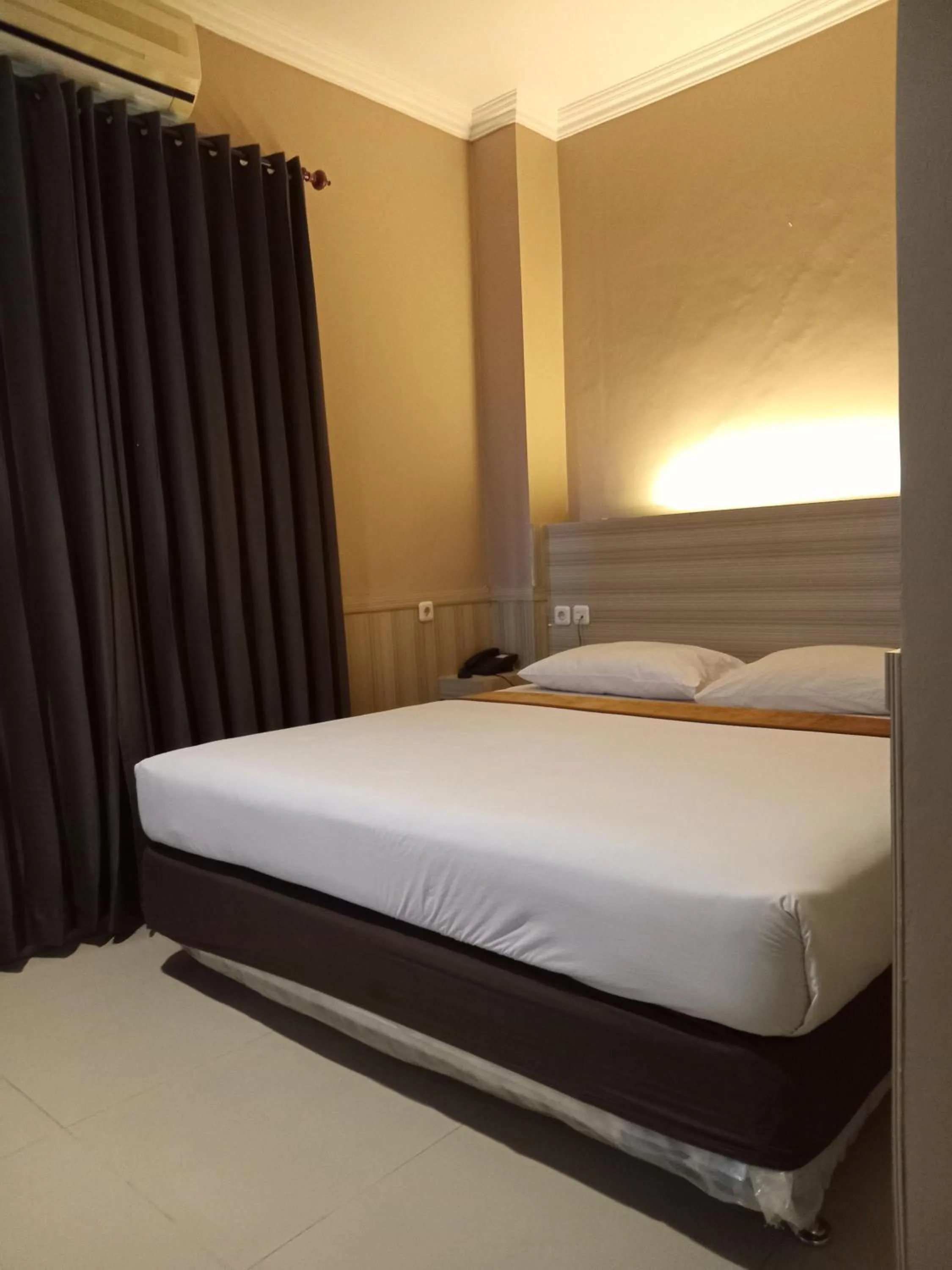 Bed in Violand Garden Hotel Samarinda