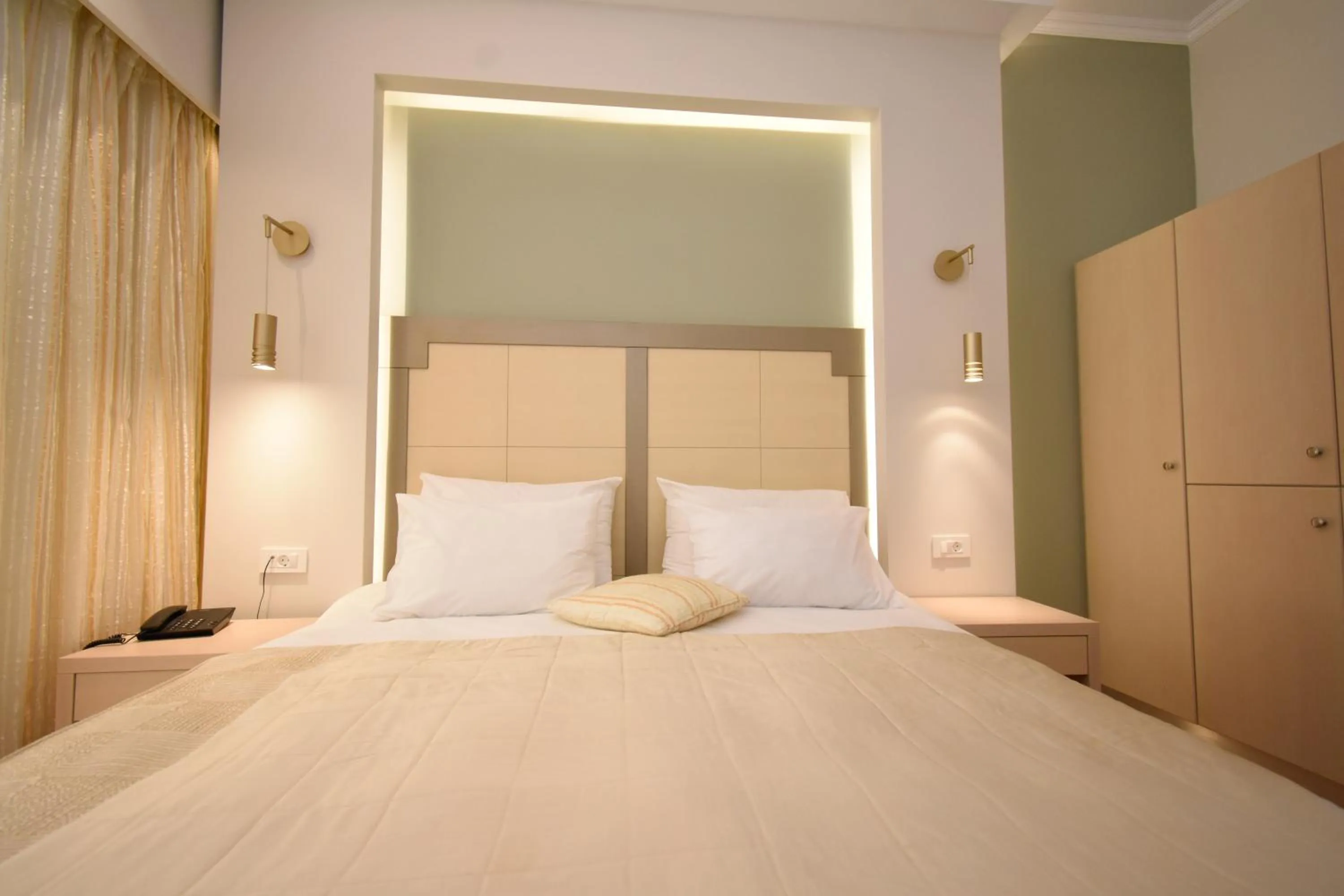 Bed in Elena Village Hotel & Suites