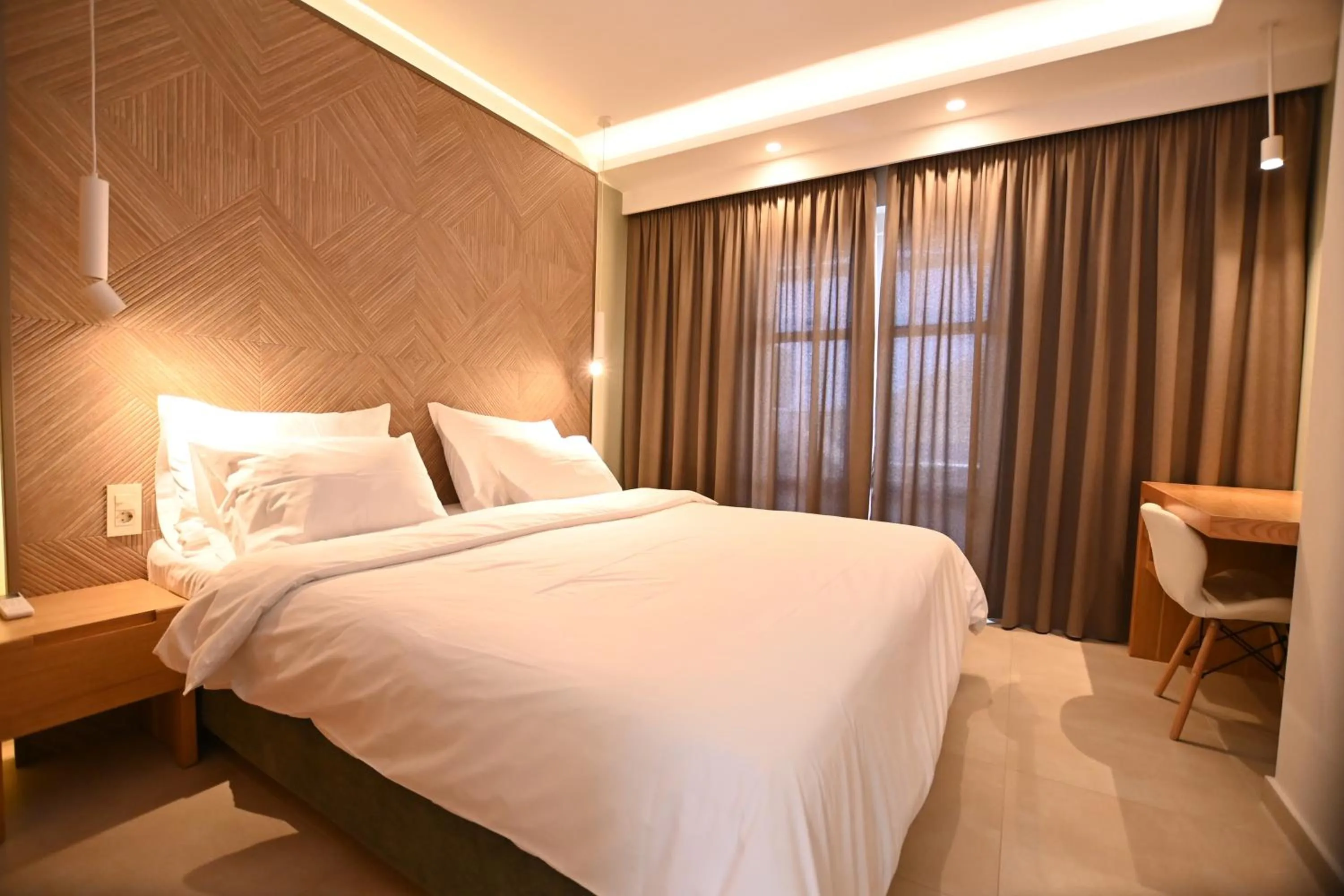 Bed in Elena Village Hotel & Suites