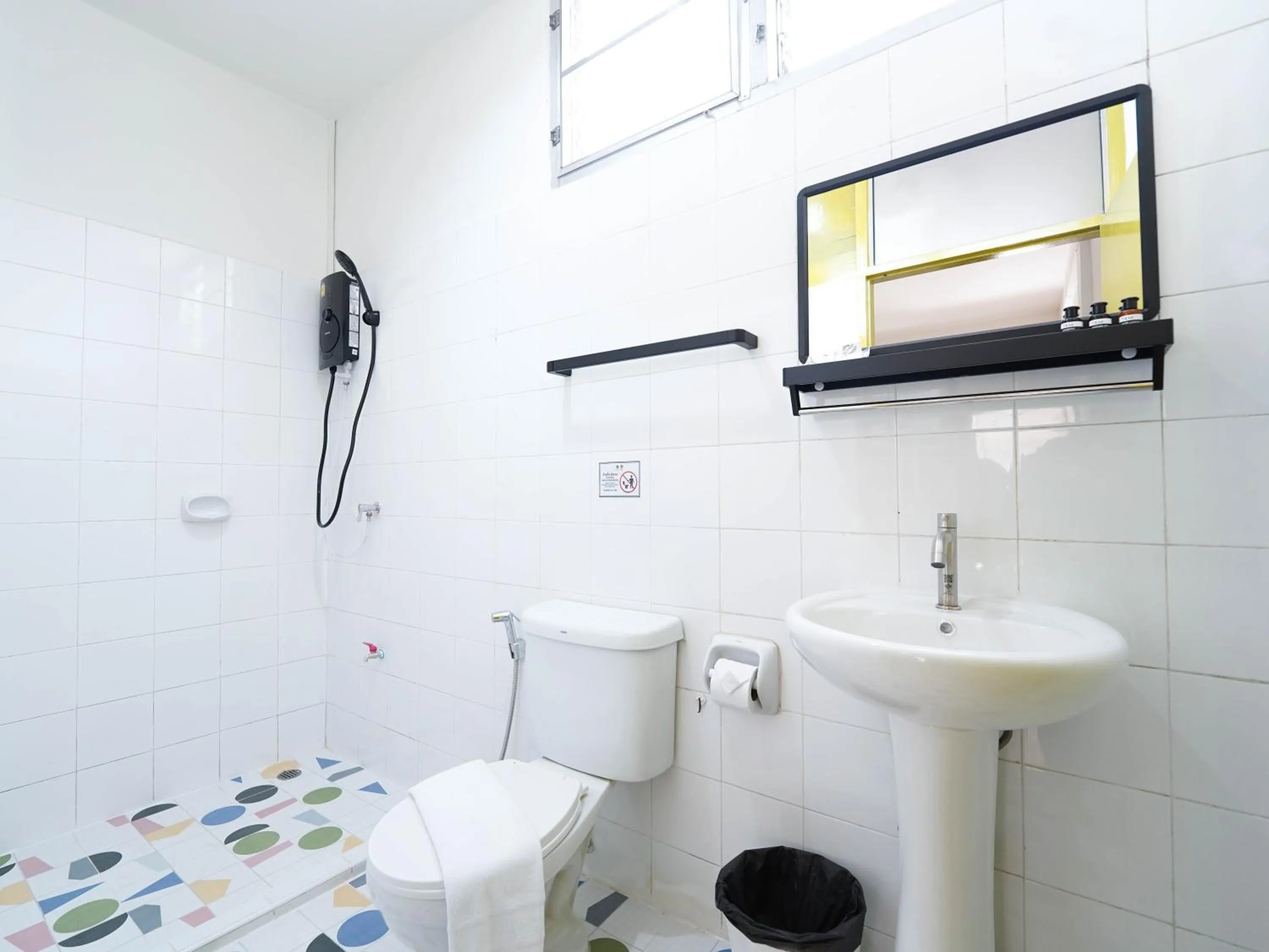 Bathroom in RoomQuest Hotel Pratunam