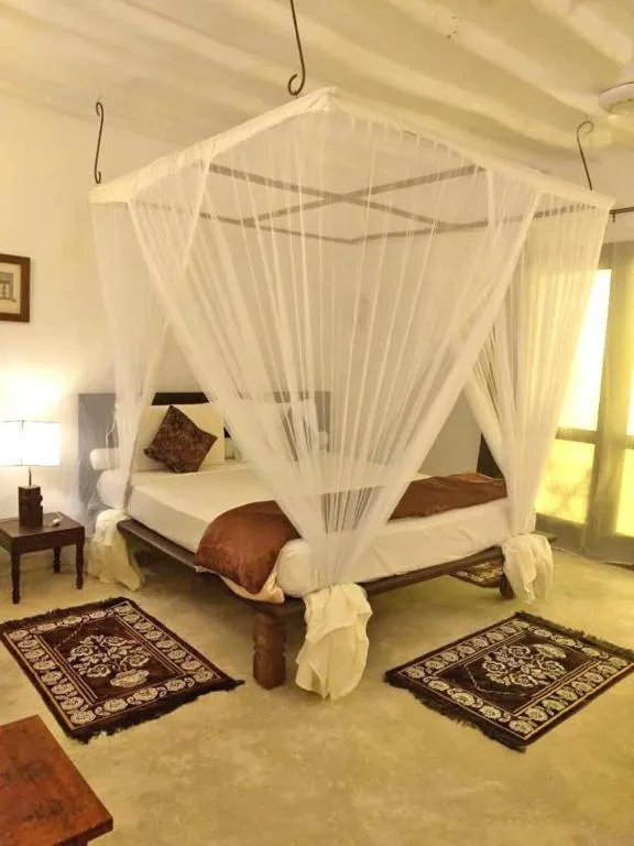 Bed in Pongwe Bay Resort