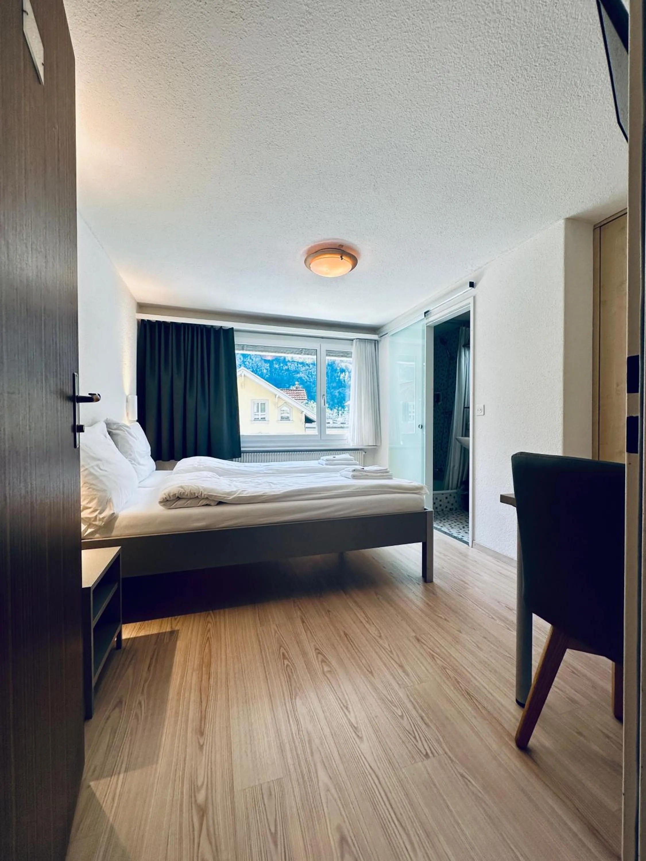 Bed in Hotel Rebstock Meiringen