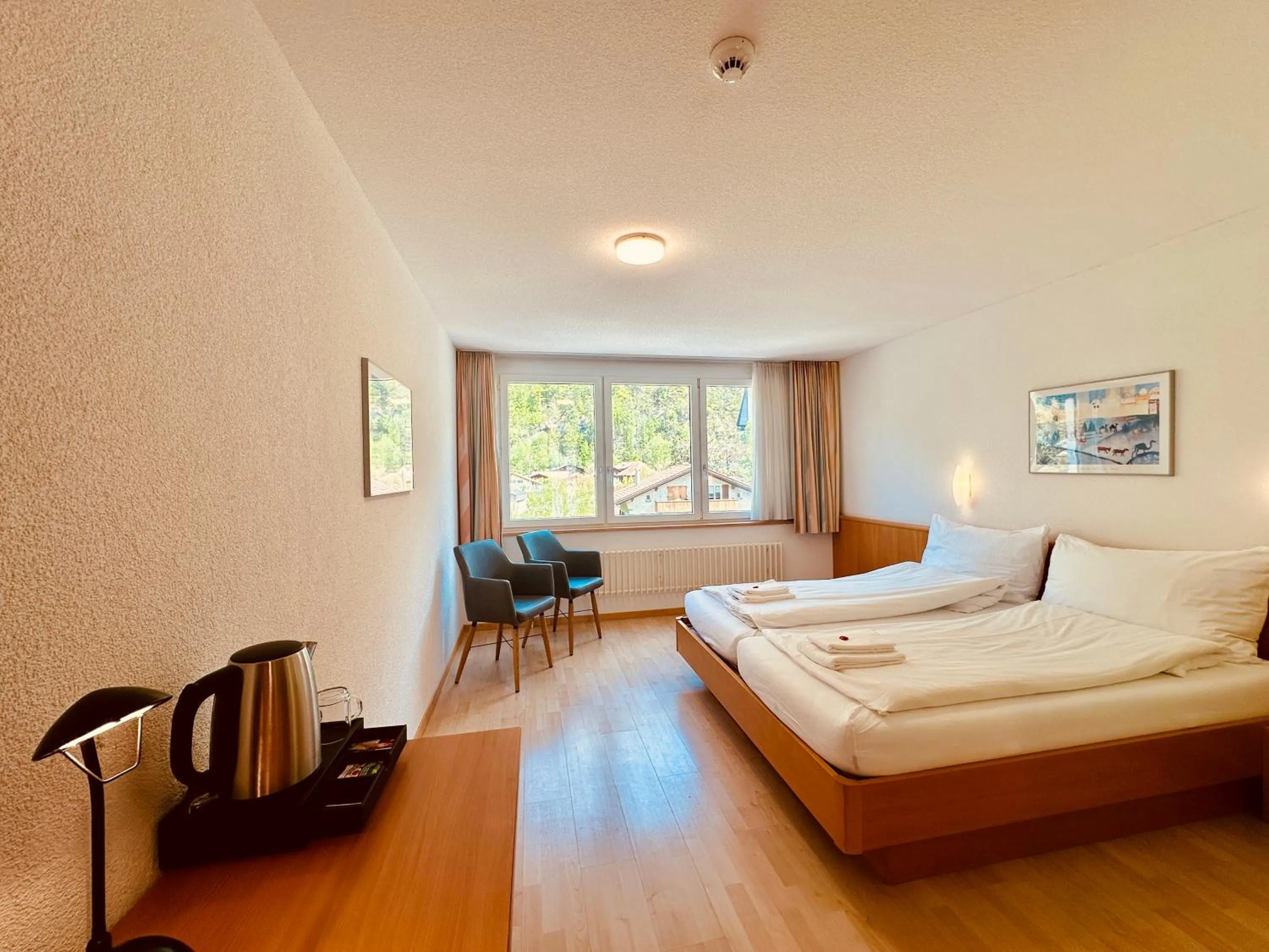 Bed in Hotel Rebstock Meiringen