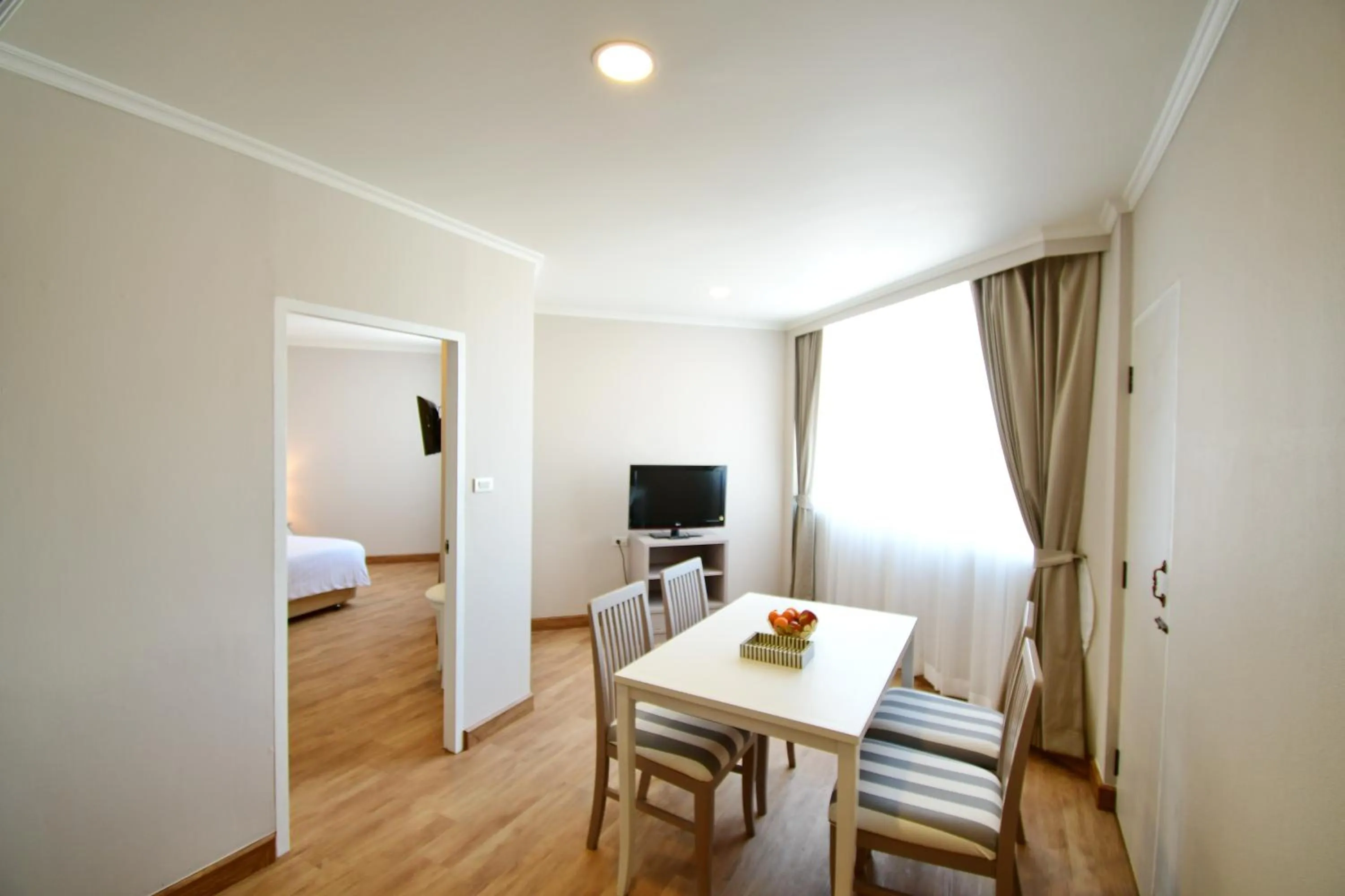 Seating area, Bed in Wangcome Hotel