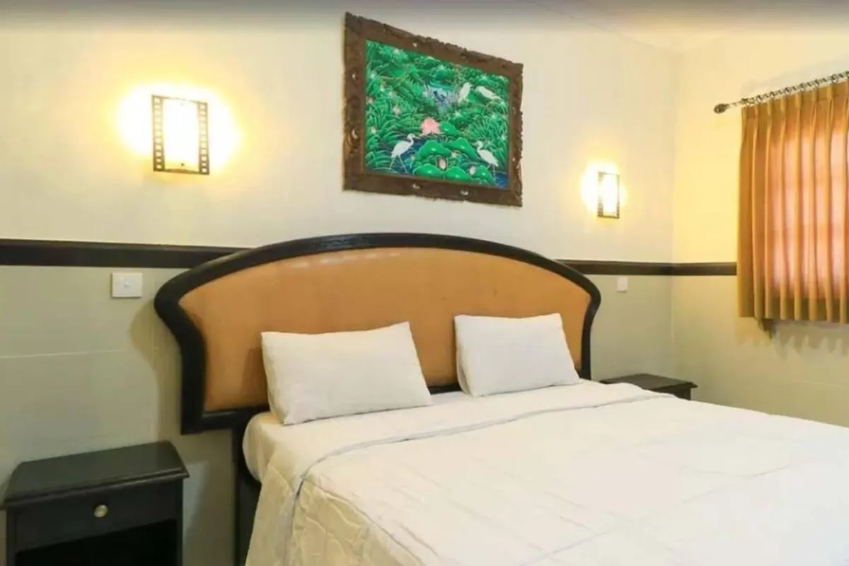 Bed in SANJAYA HOTEL