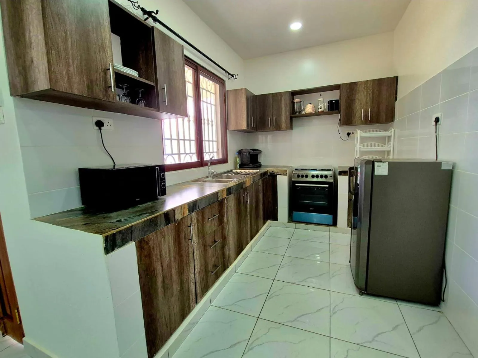 Kitchen or kitchenette in African Dream Cottages - Diani Beach