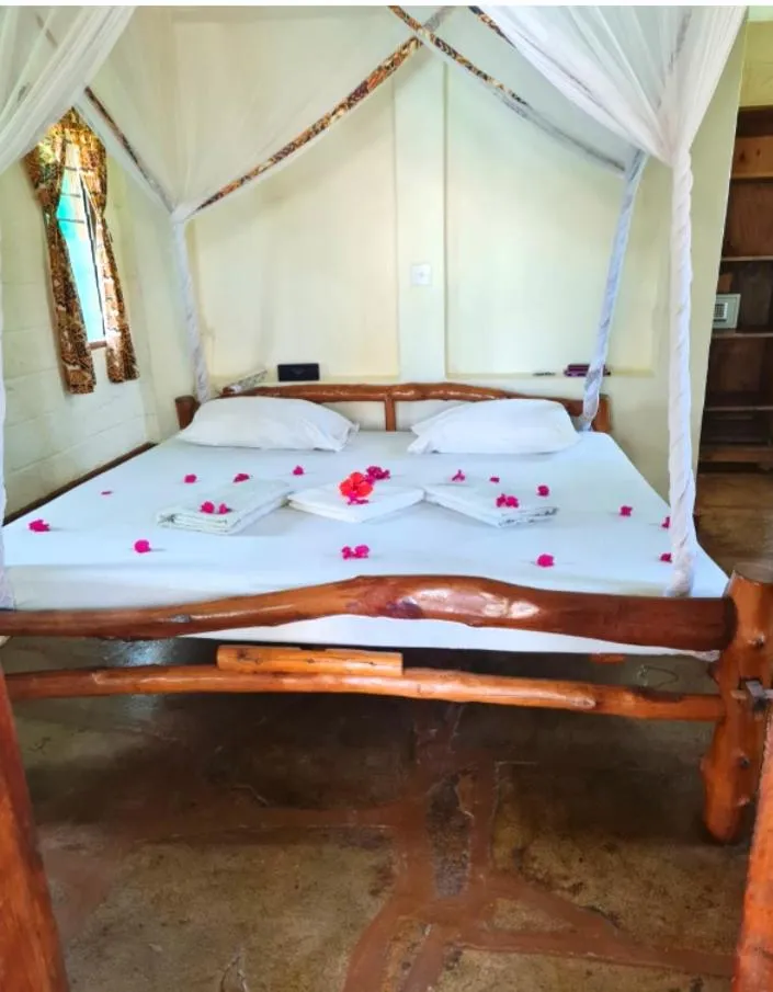 Photo of the whole room, Bed in African Dream Cottages - Diani Beach
