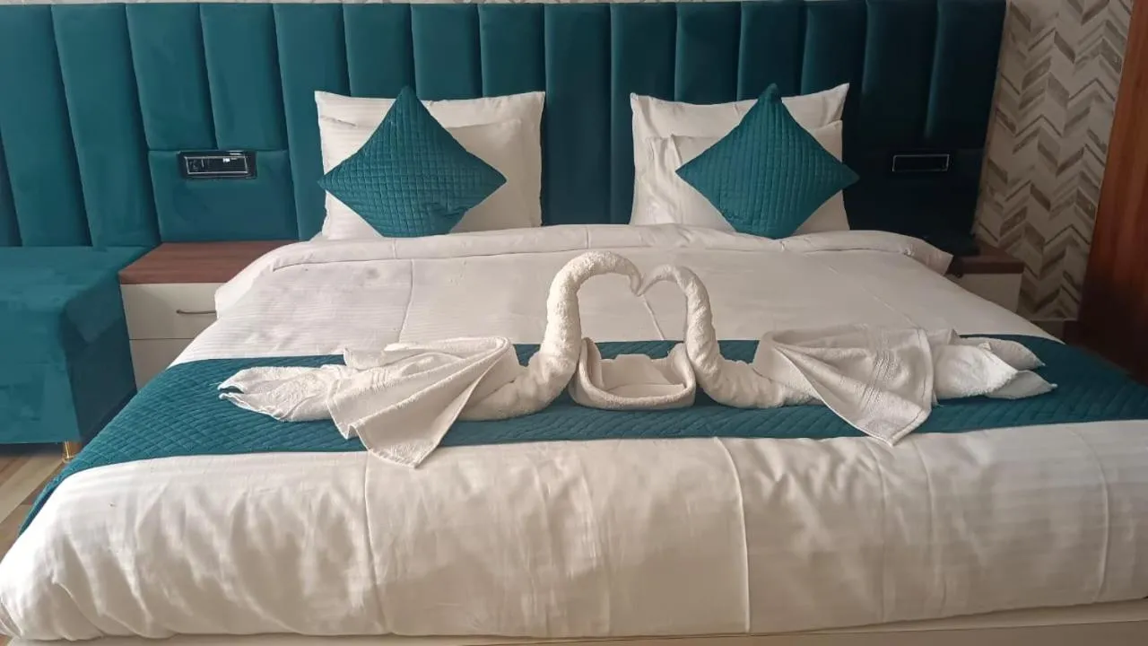 Bed in HOTEL GOLDEN PEACOCK