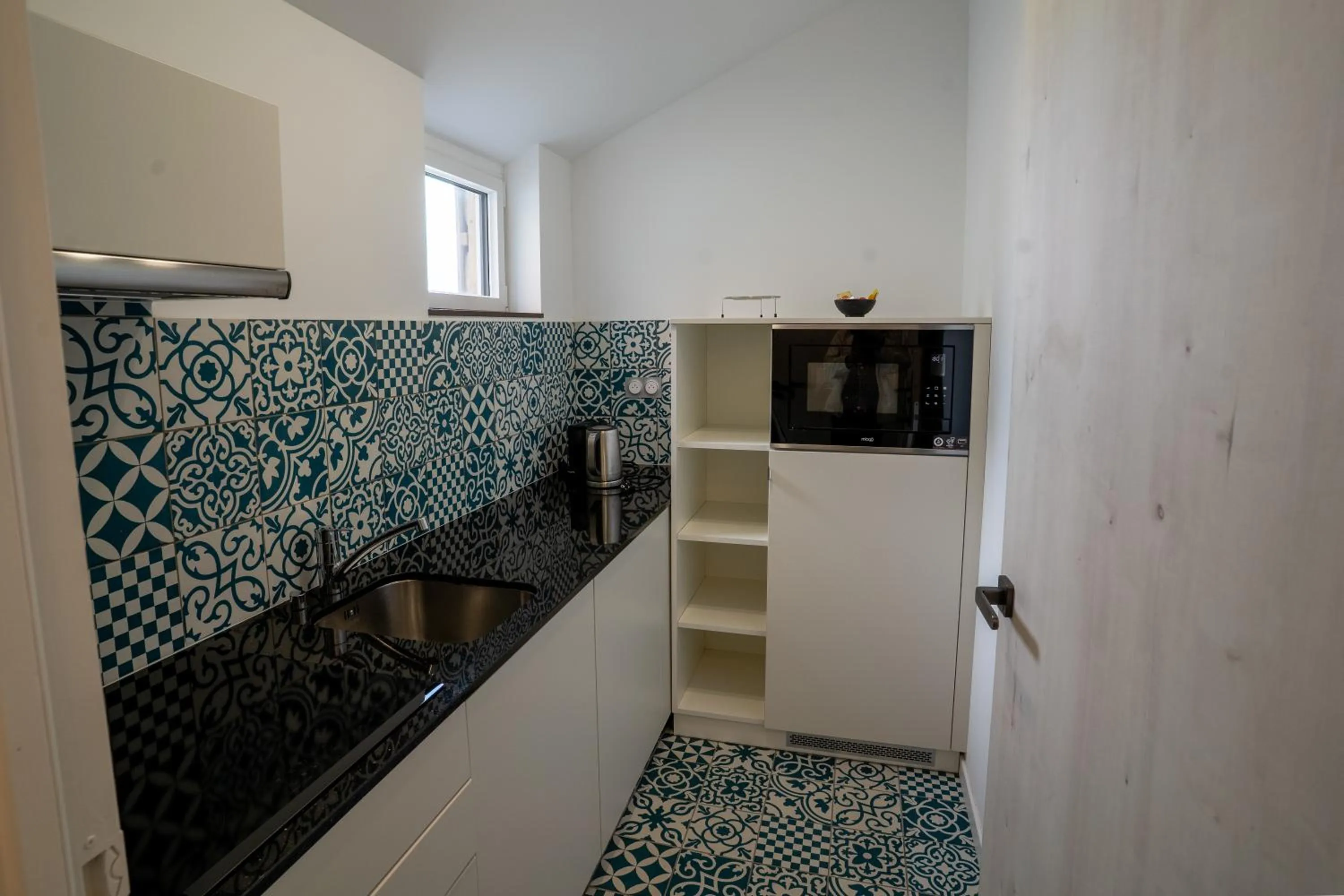 stove in Hôtel Le Manoir du Roselier