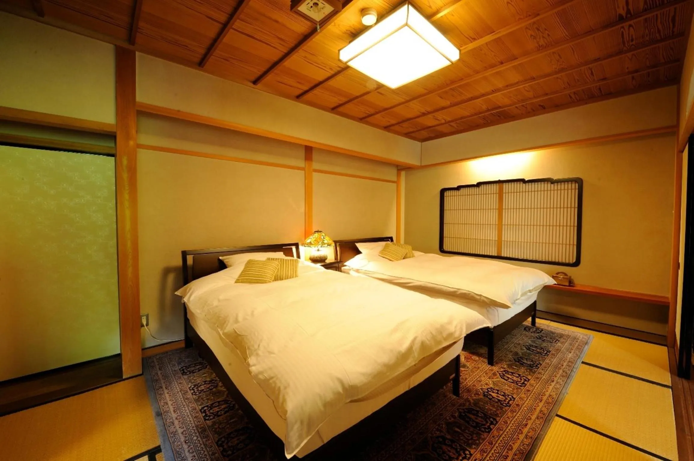 Bed in Ryoutei Ryokan Yasui