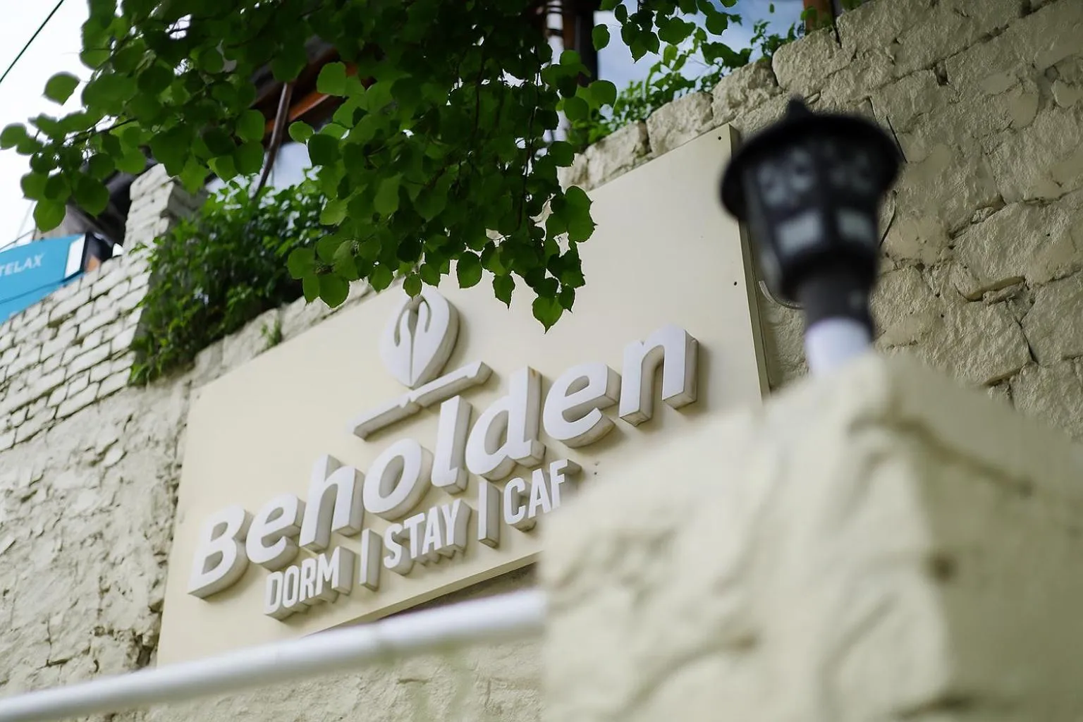 Property logo or sign in Beholden Stay And Cafe - A Luxury Boutique Hotel In Manali