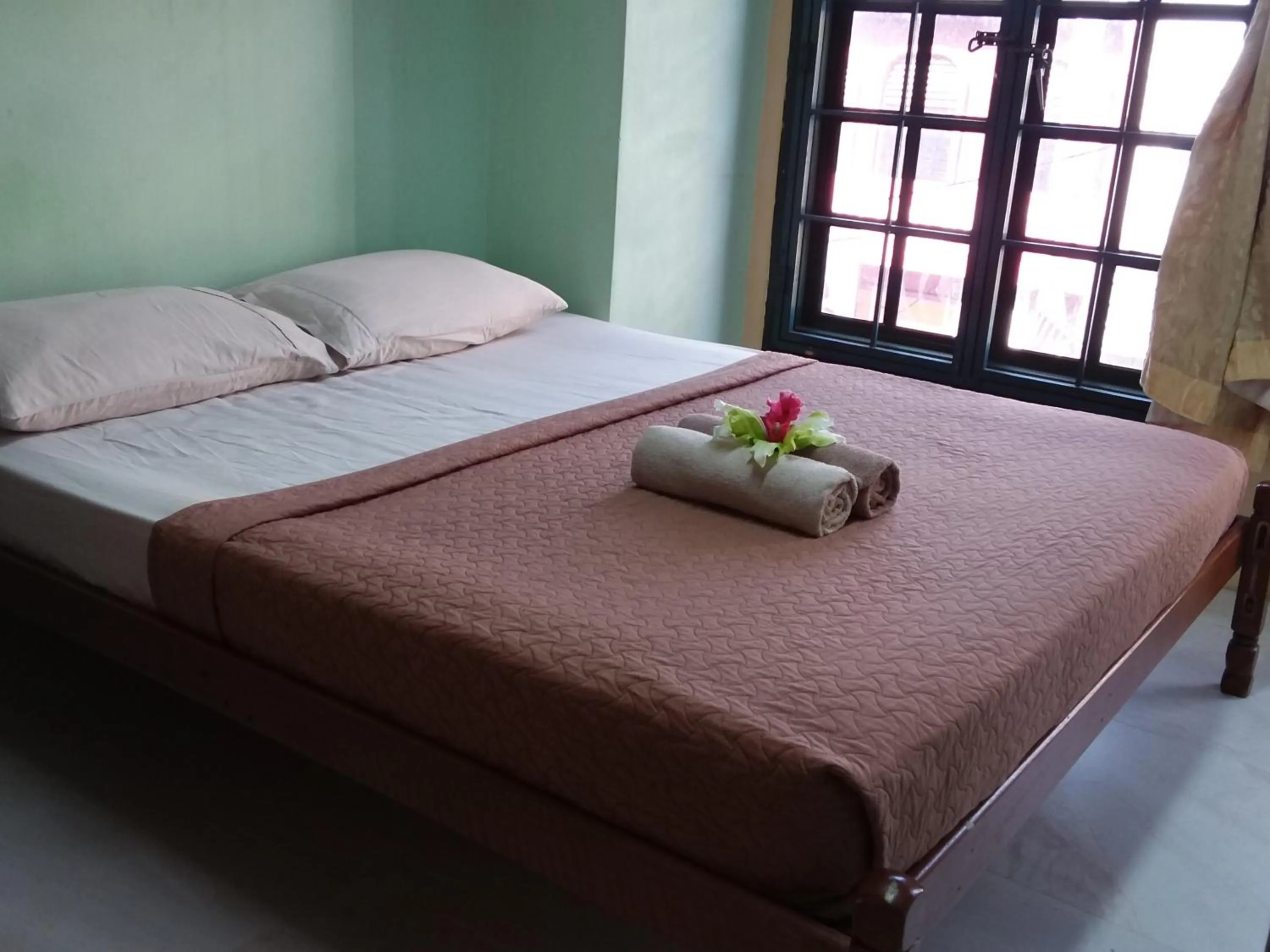 Bed in Oasis Guest House
