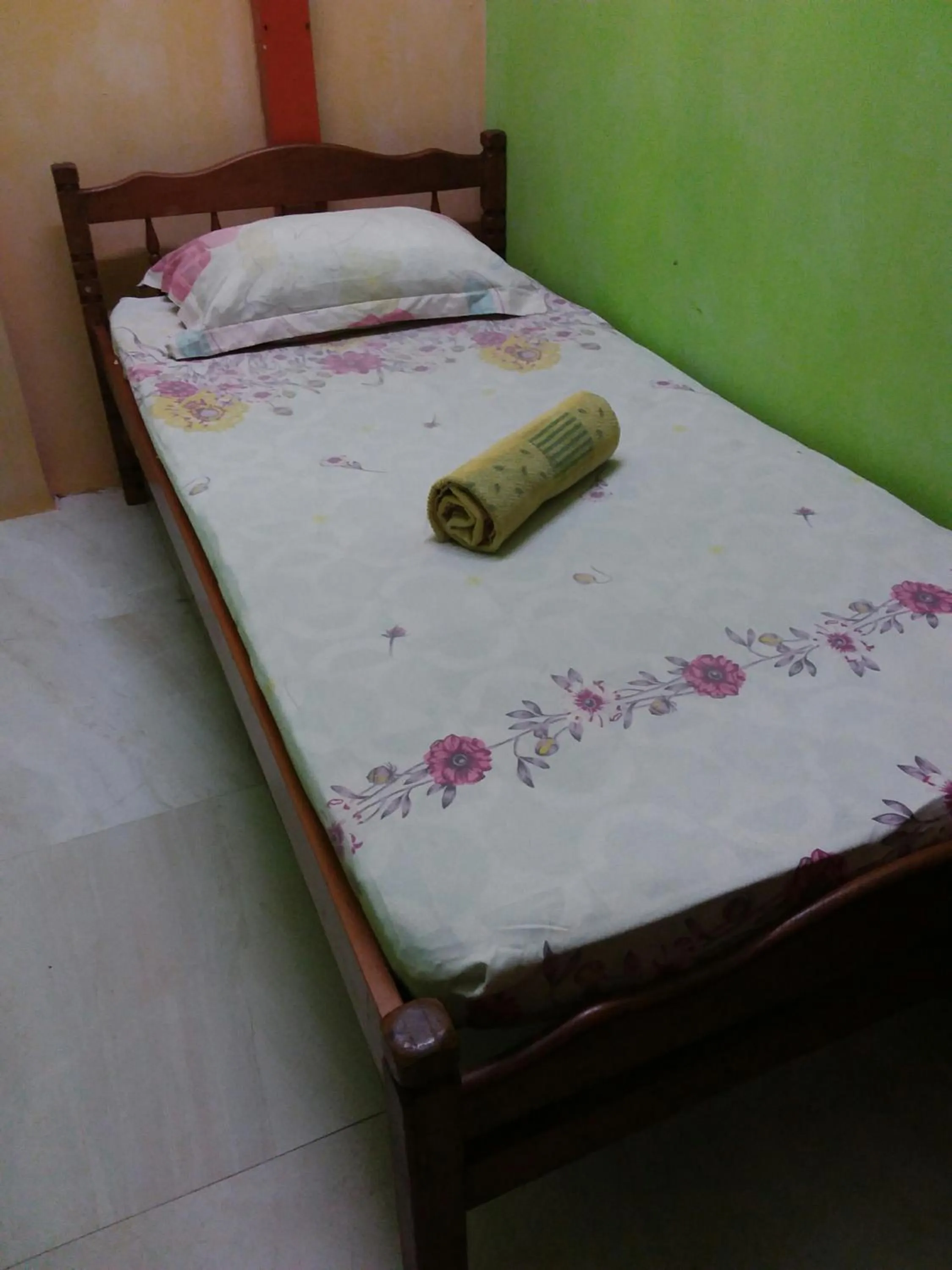 Bed in Oasis Guest House