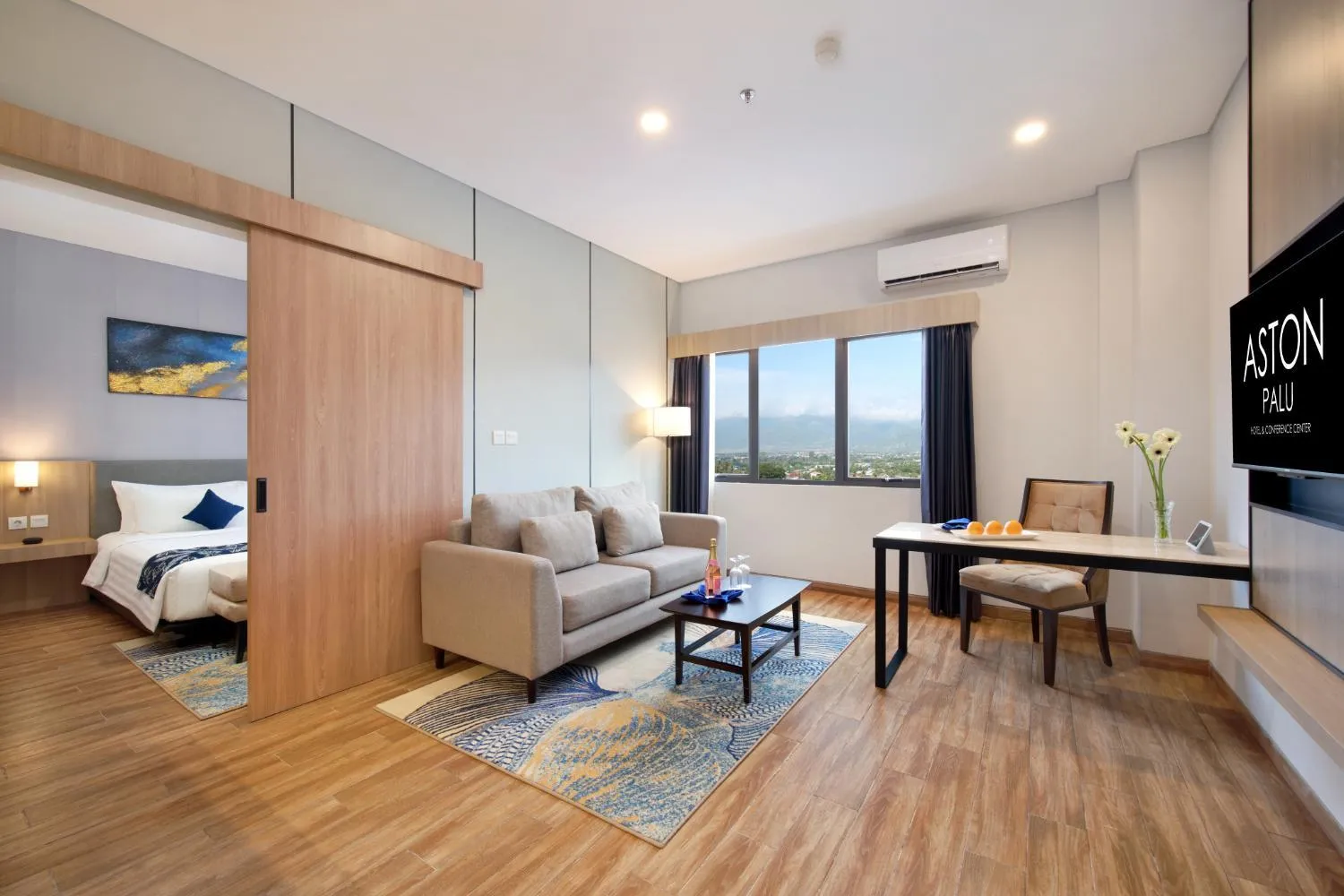 Living room, Bed in Aston Palu Hotel & Conference Center