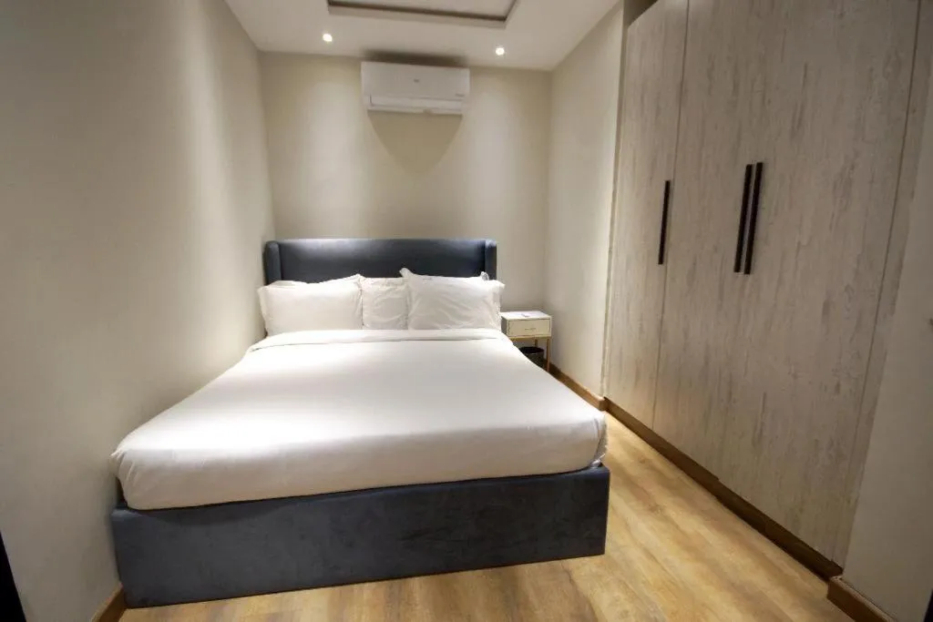 Bed in The Opus Luxury Residences