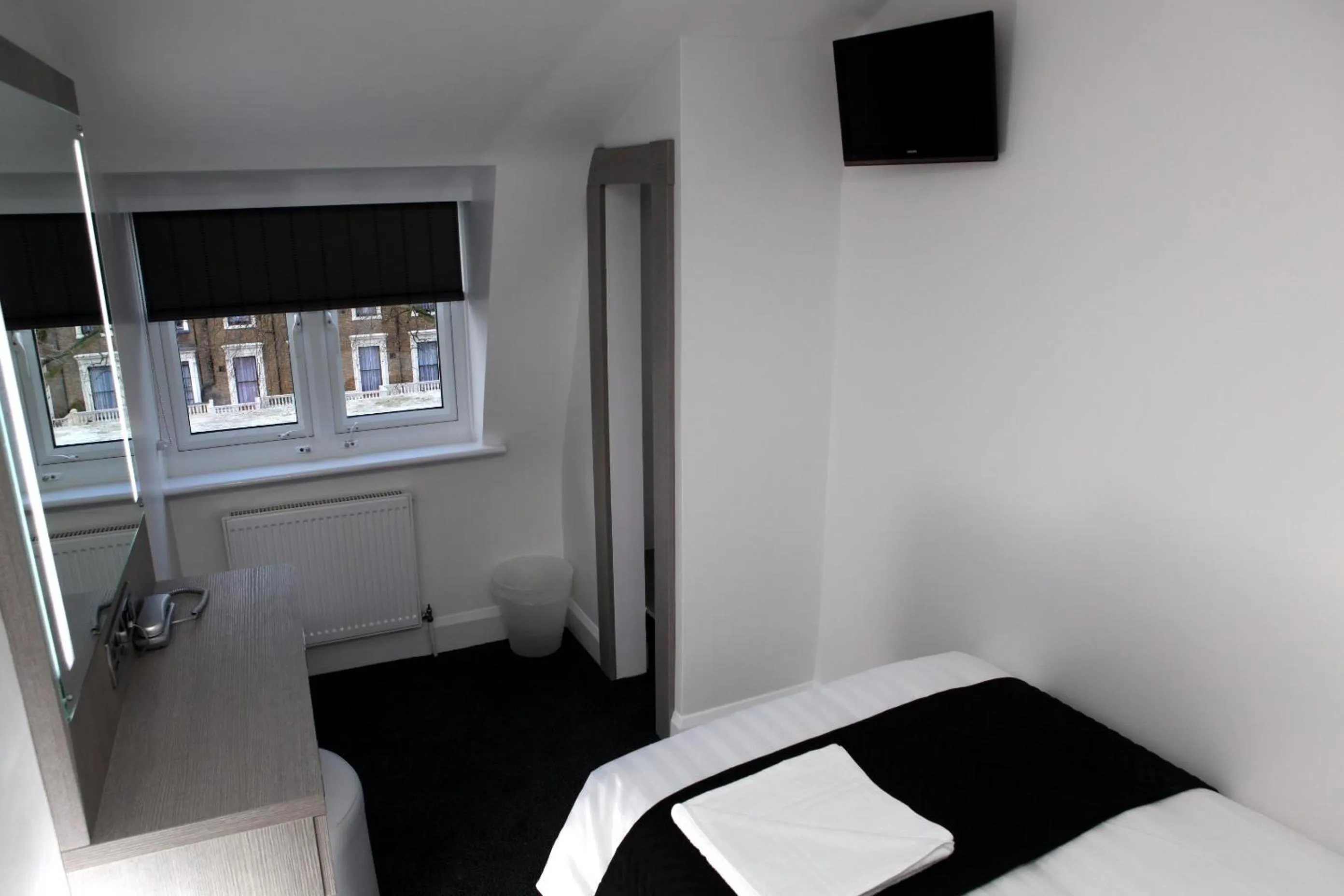 Photo of the whole room, Bed in The Omega Hotel