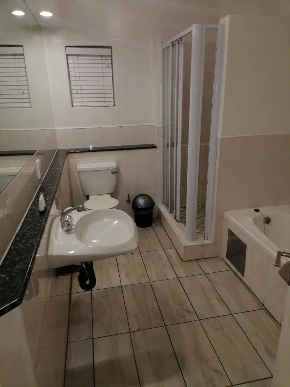 Toilet in Airport Inn and Suites