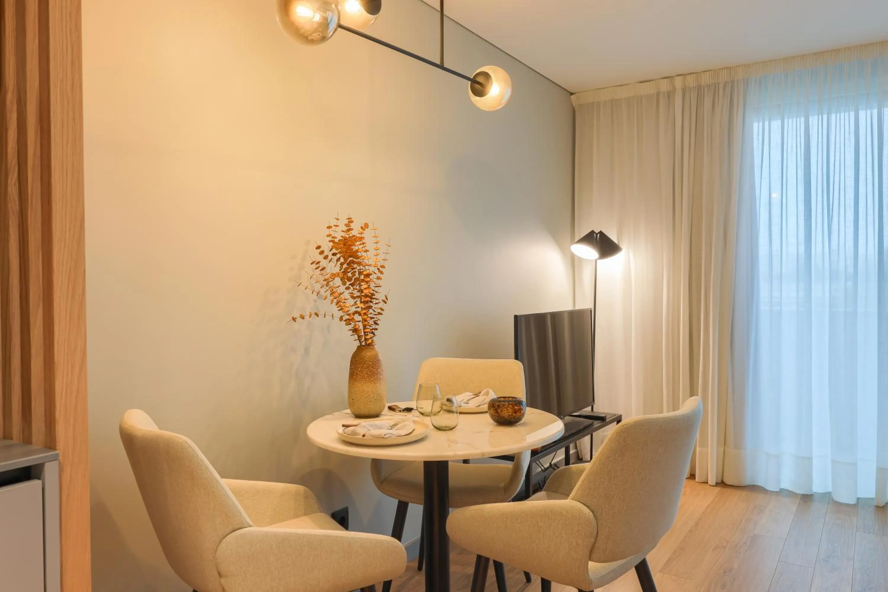 Dining area in Nôma Living Icon Apartments