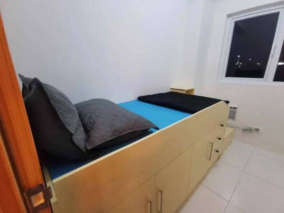 Photo of the whole room, Bed in Naga City Stylish Condo