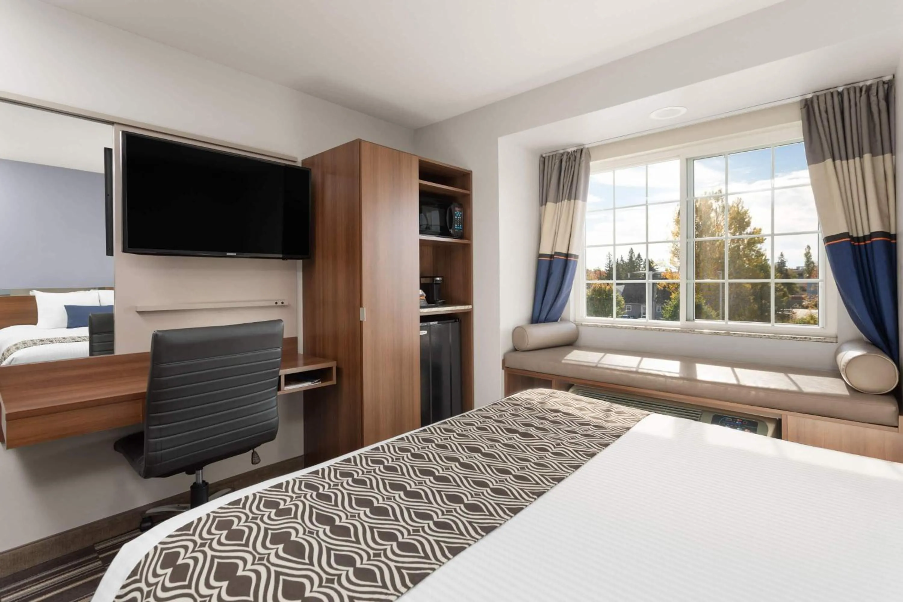 Photo of the whole room, Bed in Microtel Inn & Suites Sault Ste. Marie