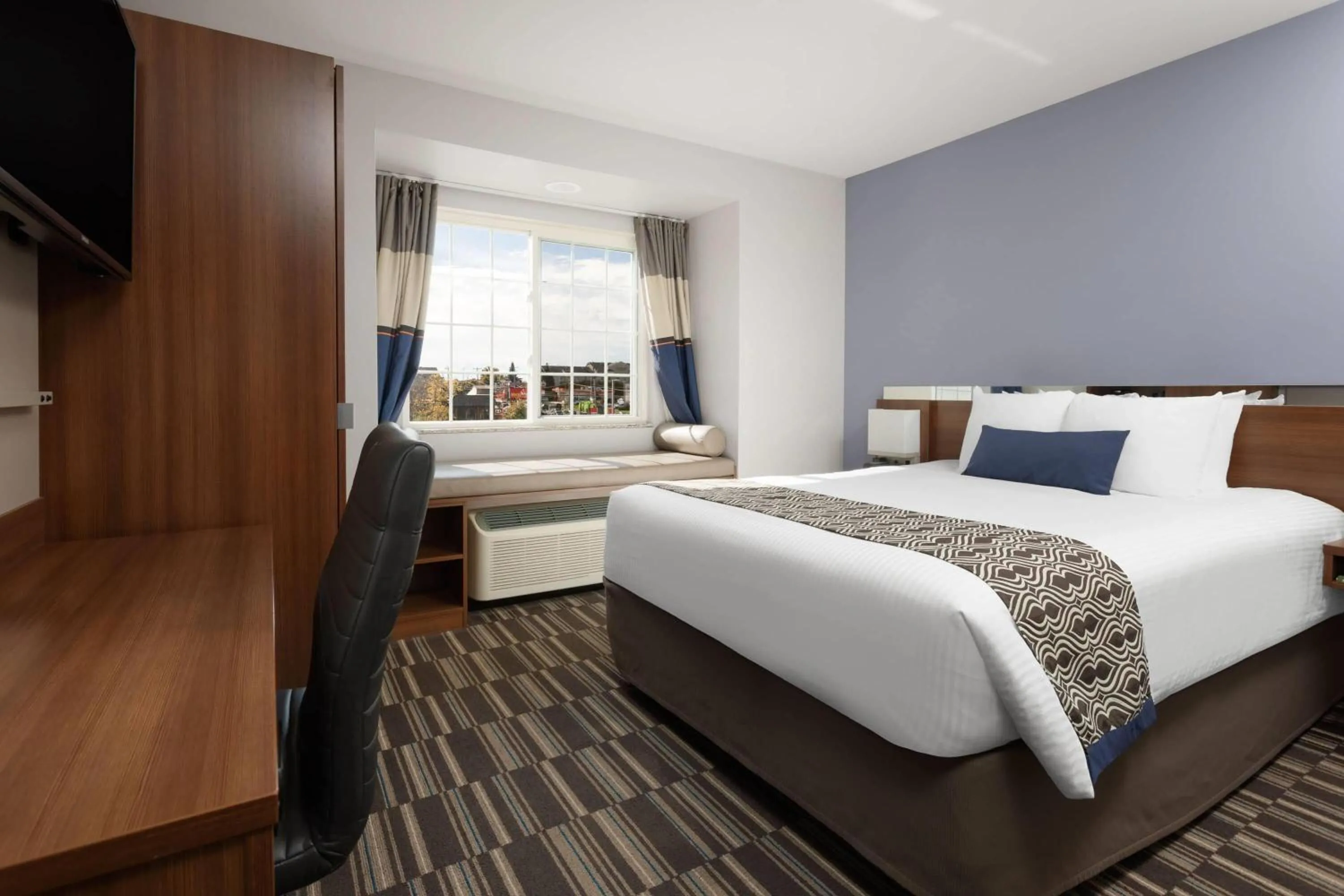 Photo of the whole room, Bed in Microtel Inn & Suites Sault Ste. Marie