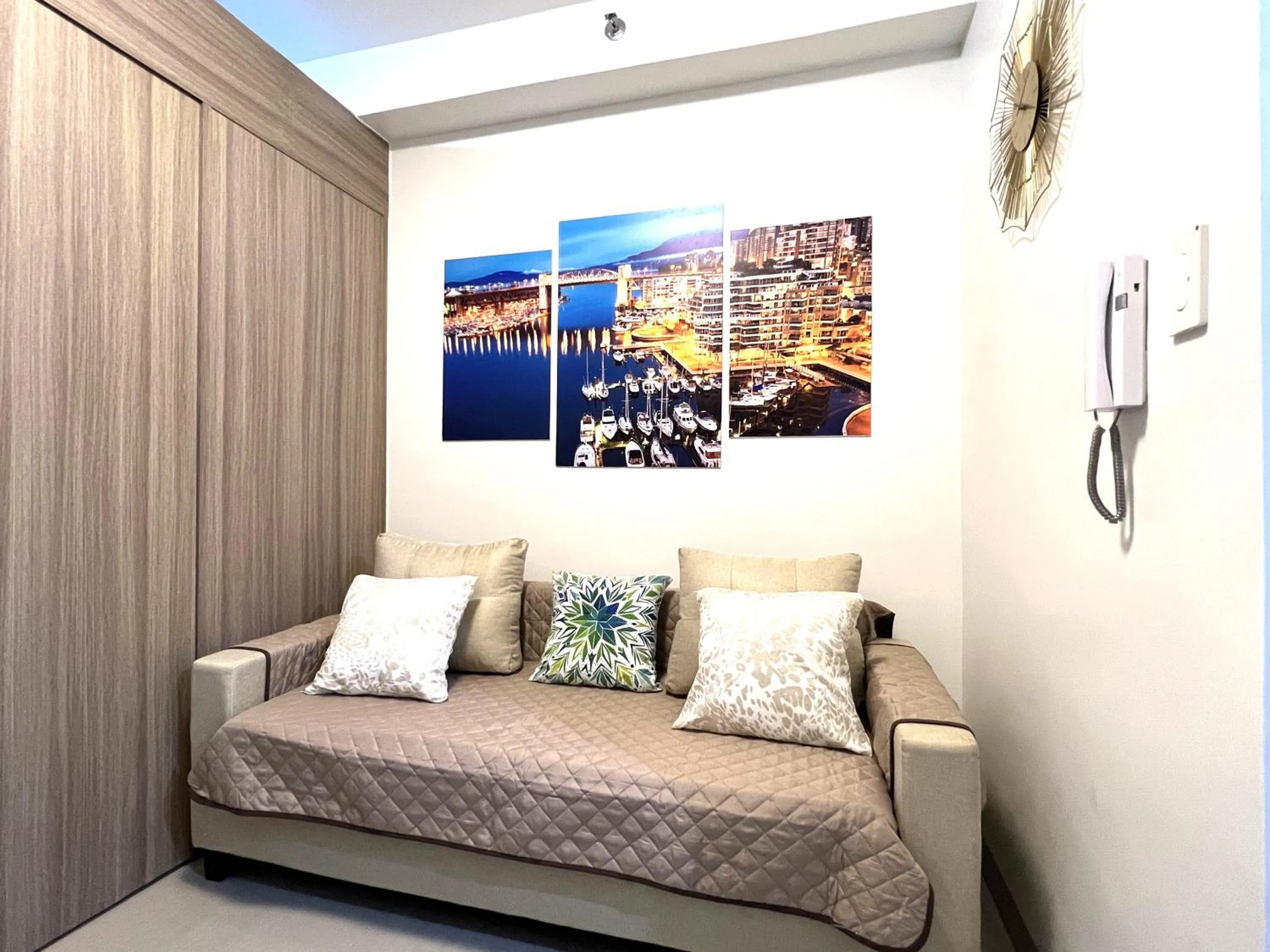 Living room, Bed in Shore Residences MOA Dynastel Staycation