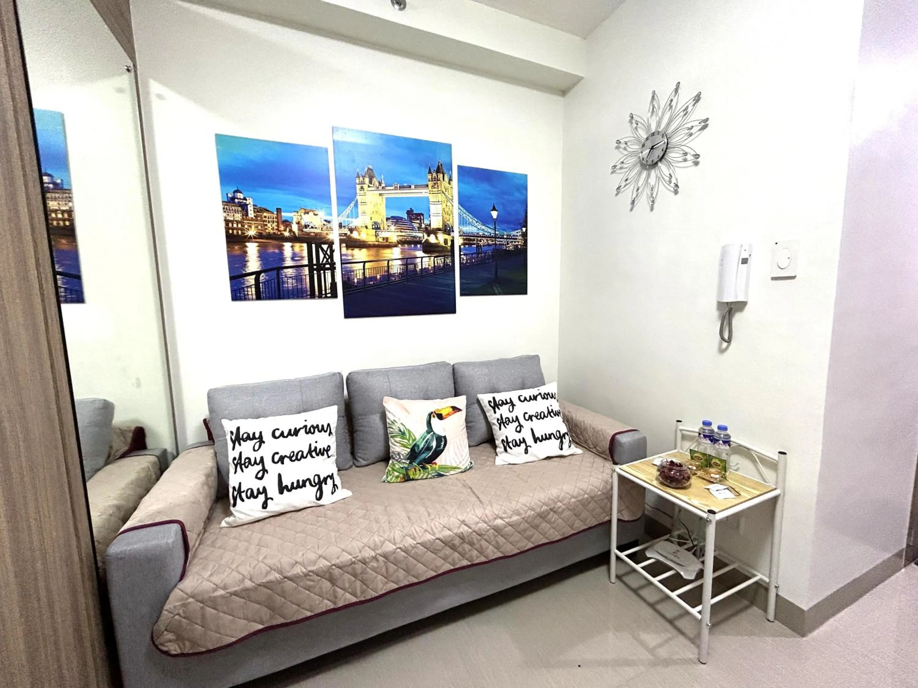 Living room, Bed in Shore Residences MOA Dynastel Staycation