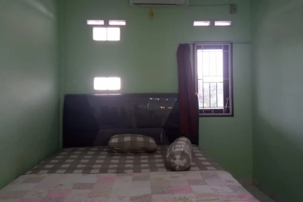 Bedroom in Hotel O White House SyariahNearOYO 93457 White House Syariah