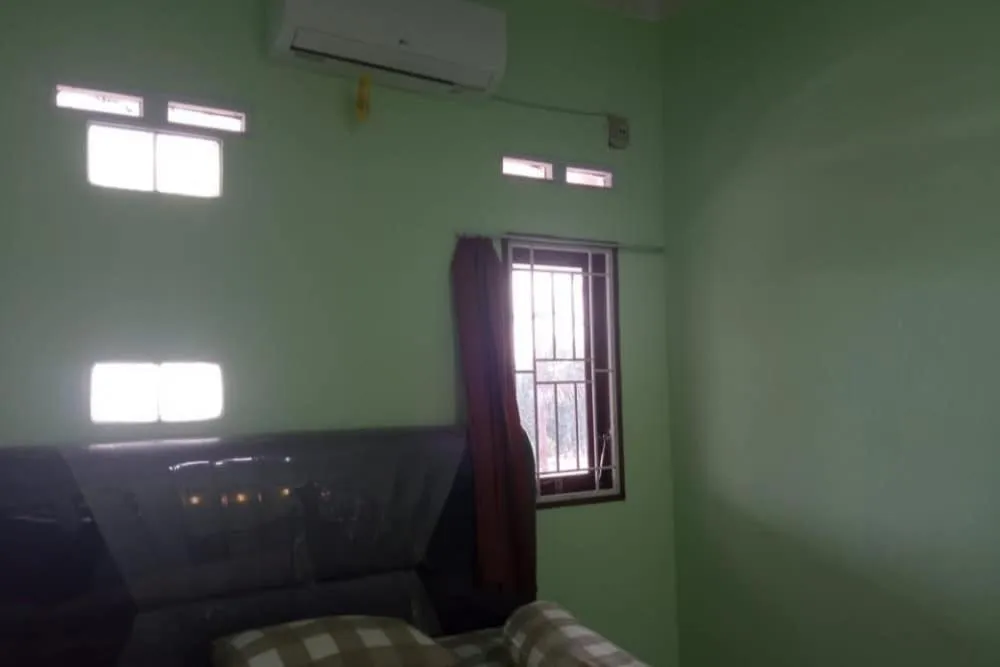 Bedroom in Hotel O White House SyariahNearOYO 93457 White House Syariah