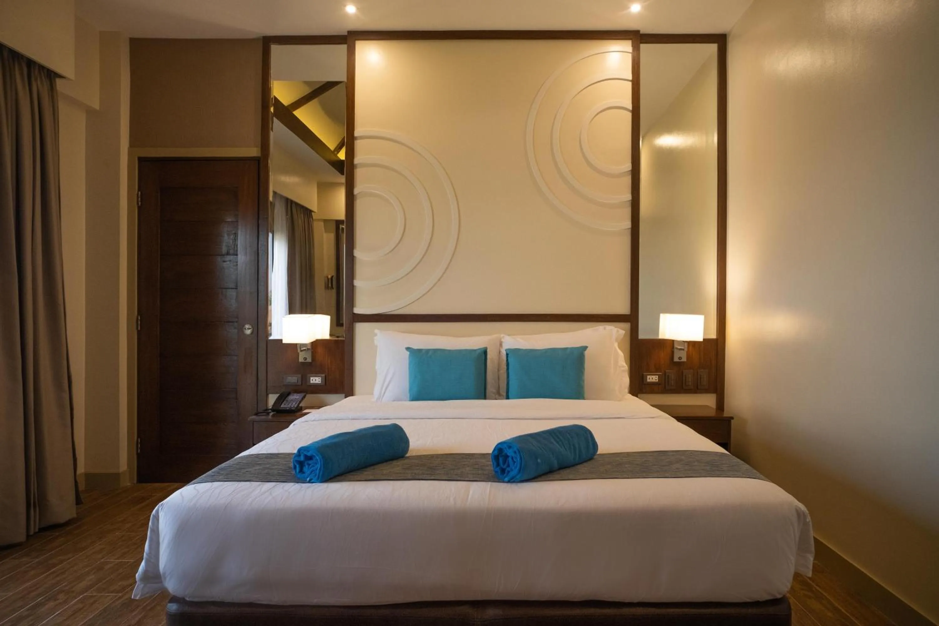 Bed in Parklane Bohol Resort and Spa