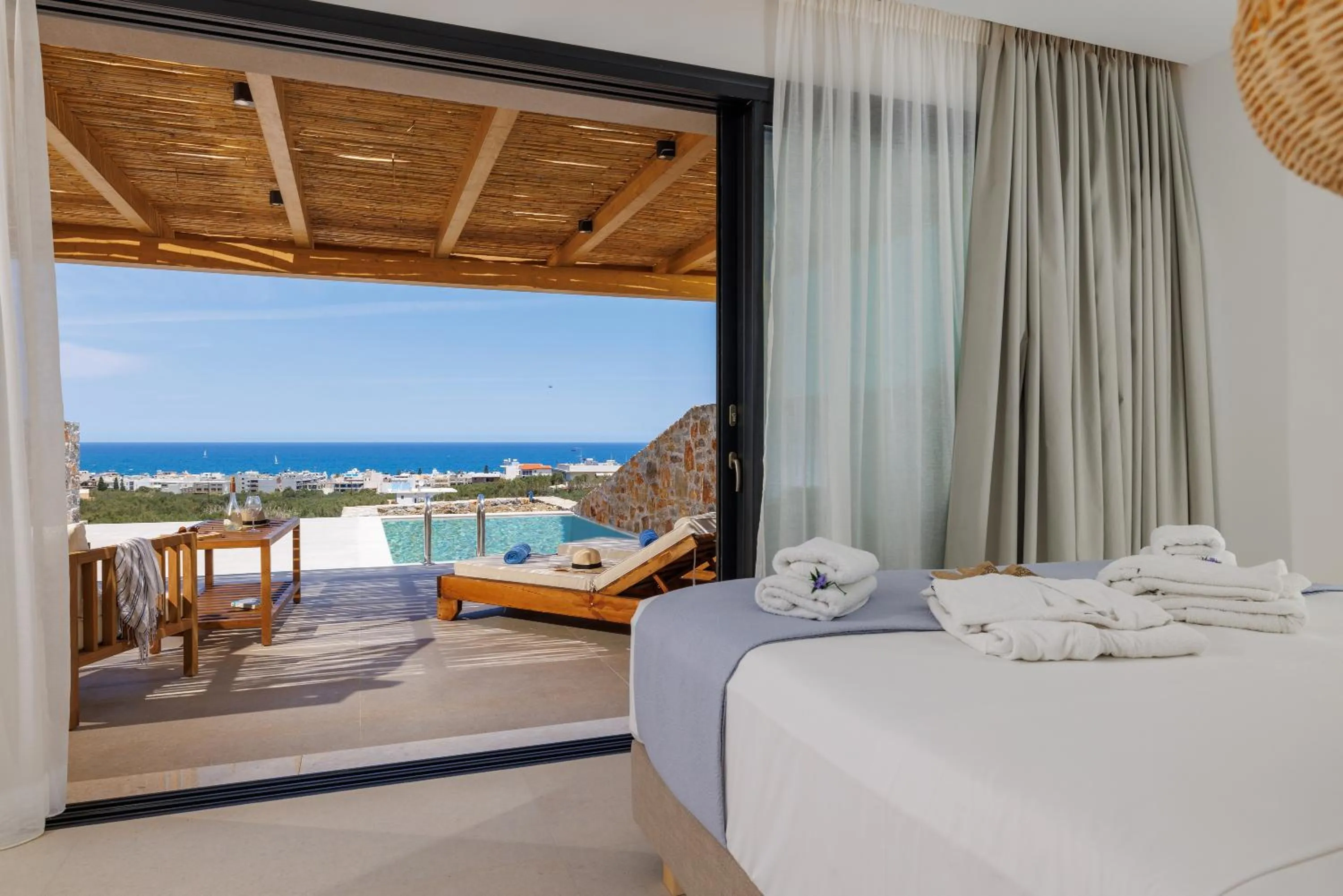 Bed in Deos Luxury Suites - Adults Only