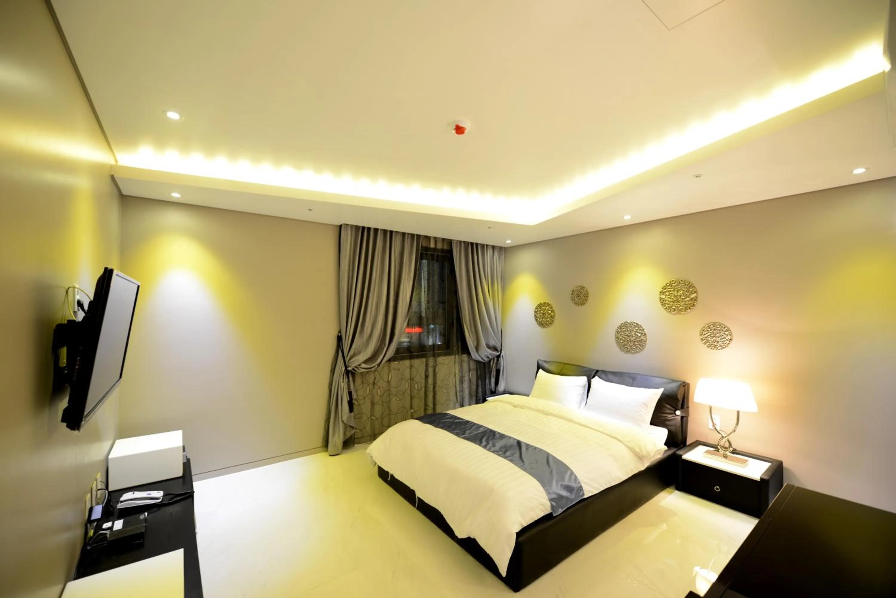Bed in Dunsan Graytone Hotel