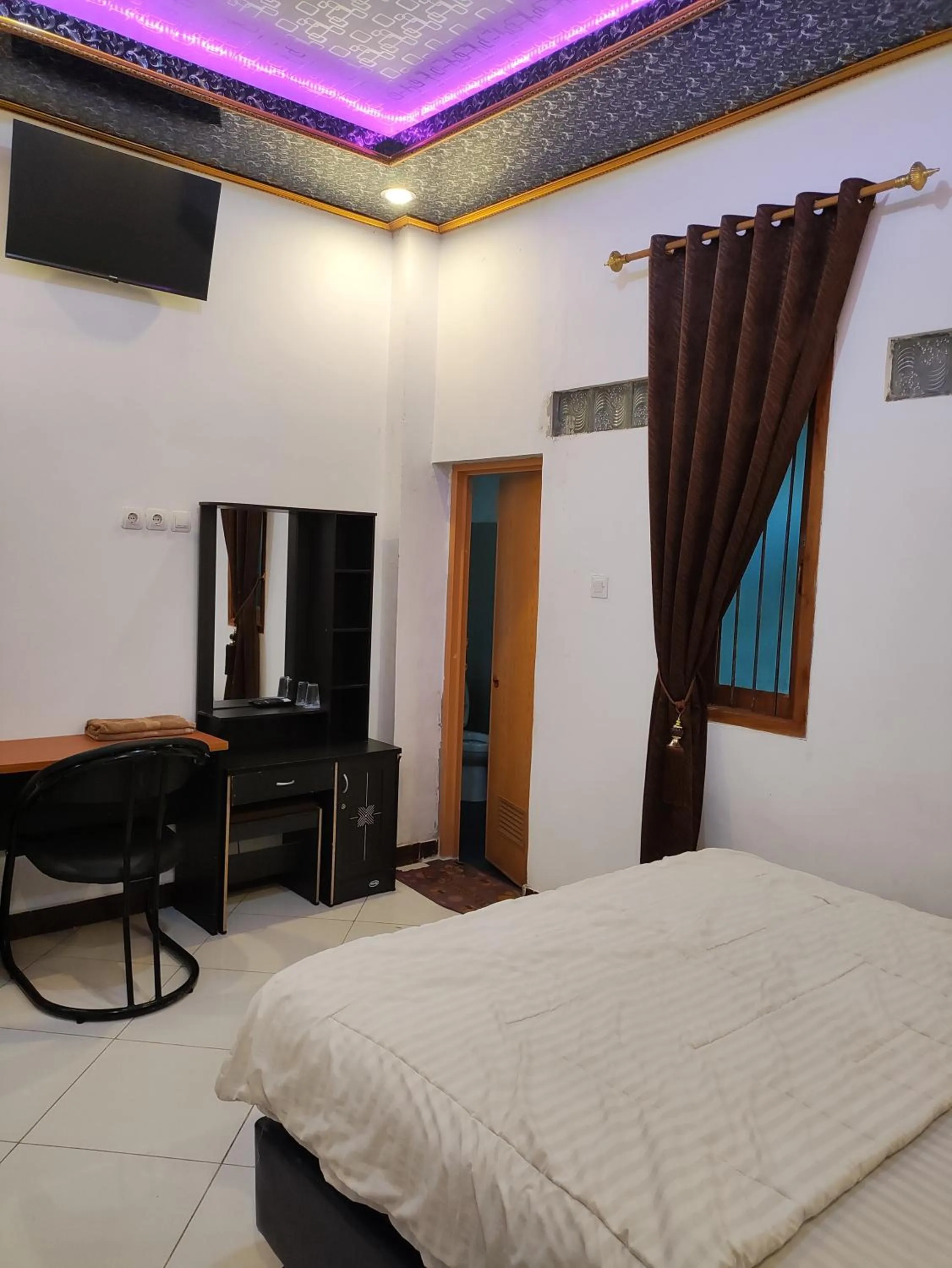 Bed in Penginapan Nurmega jaya