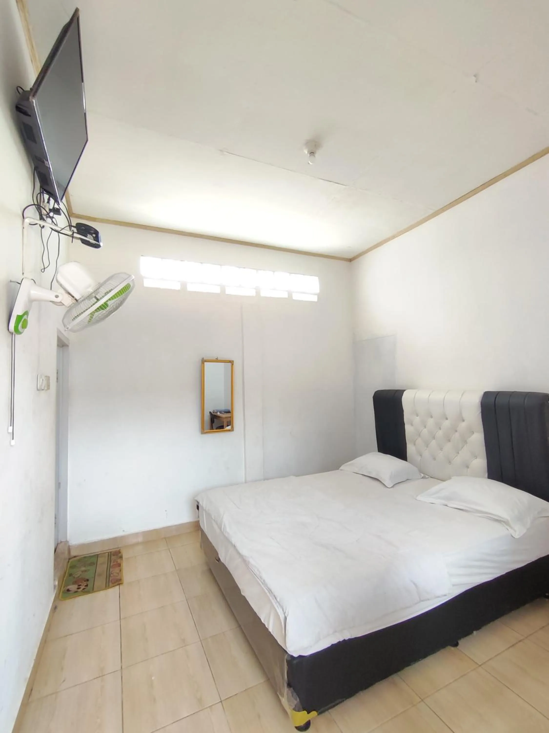 Bed in Penginapan Nurmega jaya