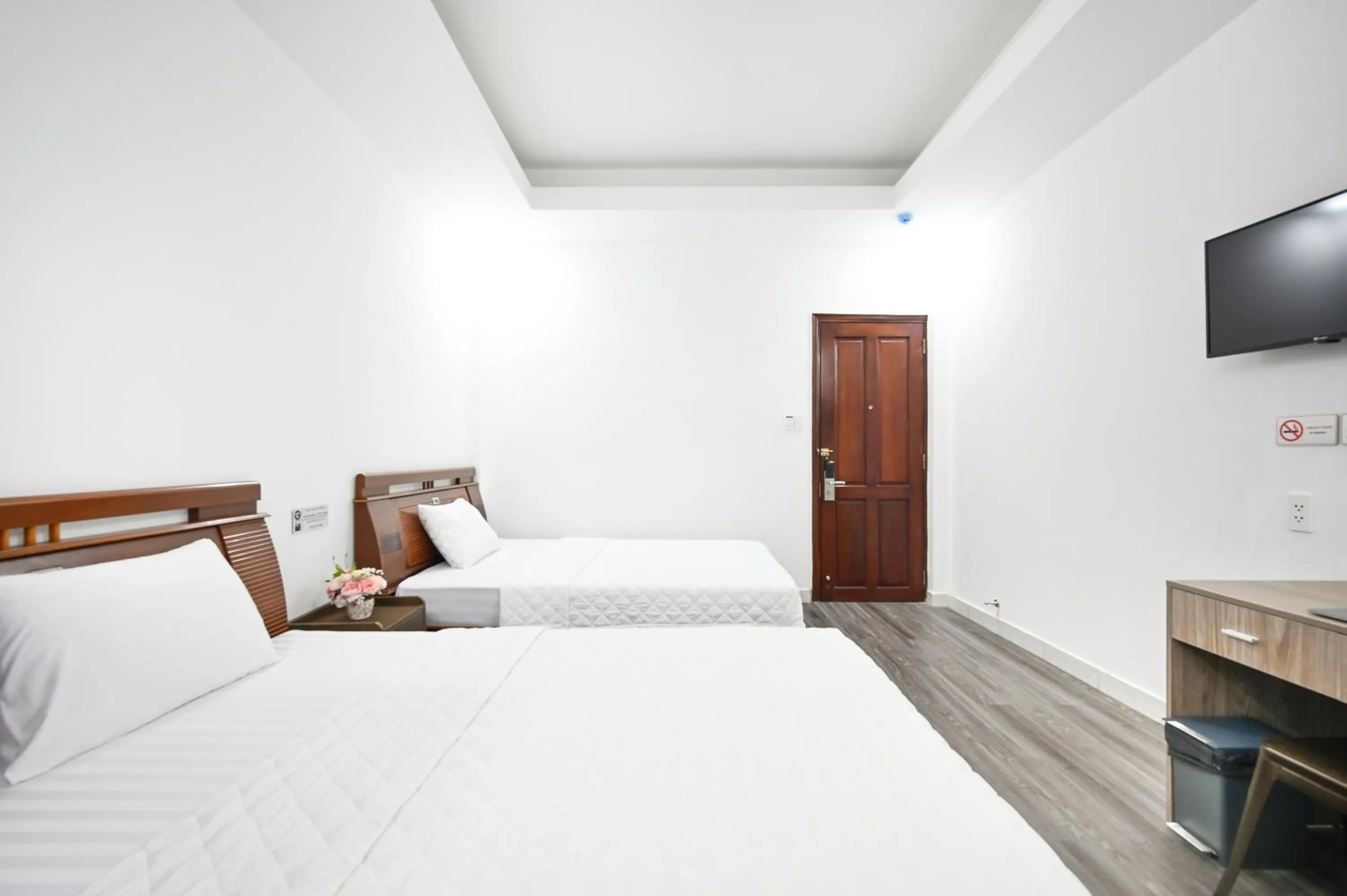 Bed in YoKo Airport Saigon Hotel