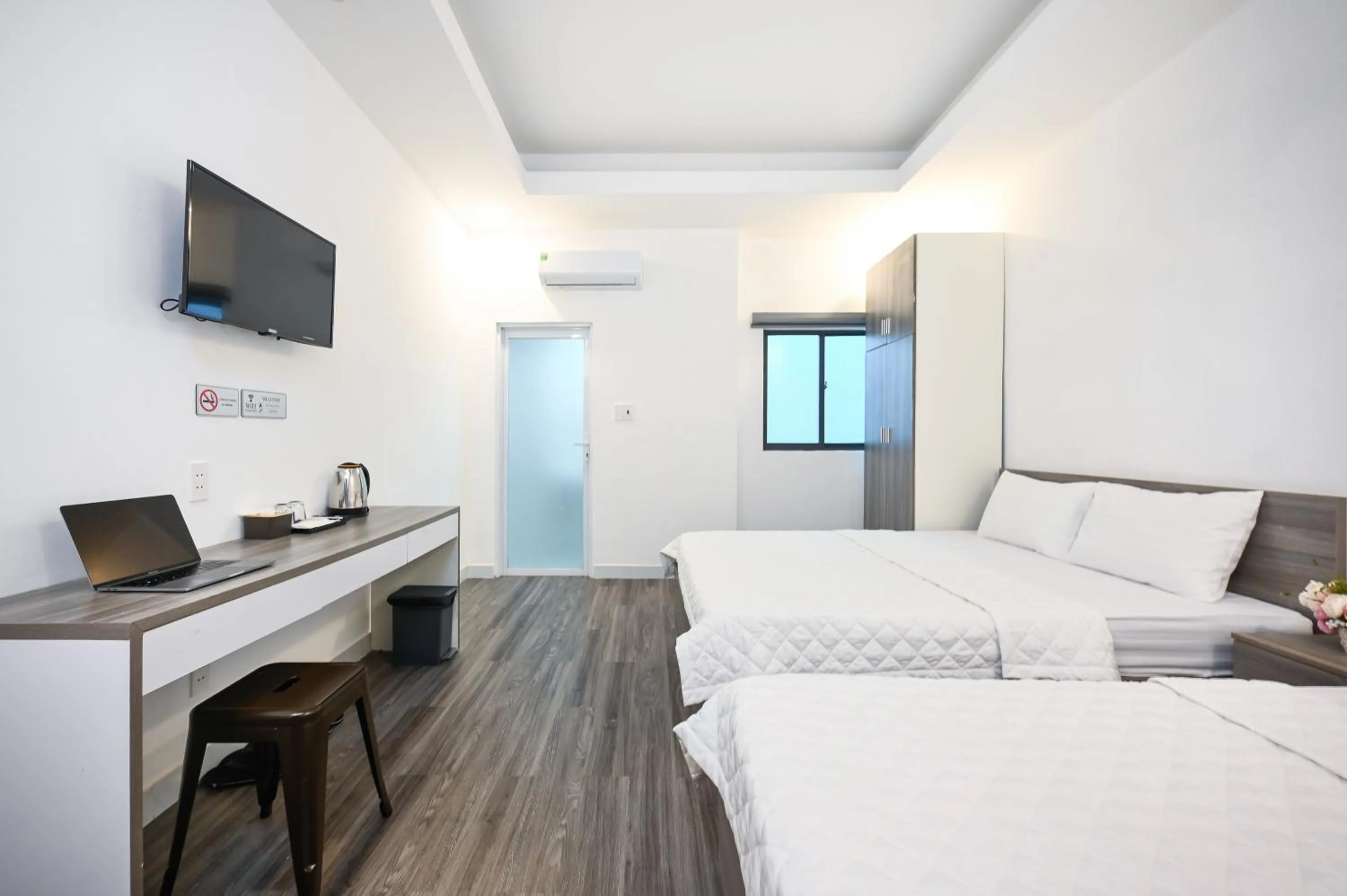 TV and multimedia, Bed in YoKo Airport Saigon Hotel