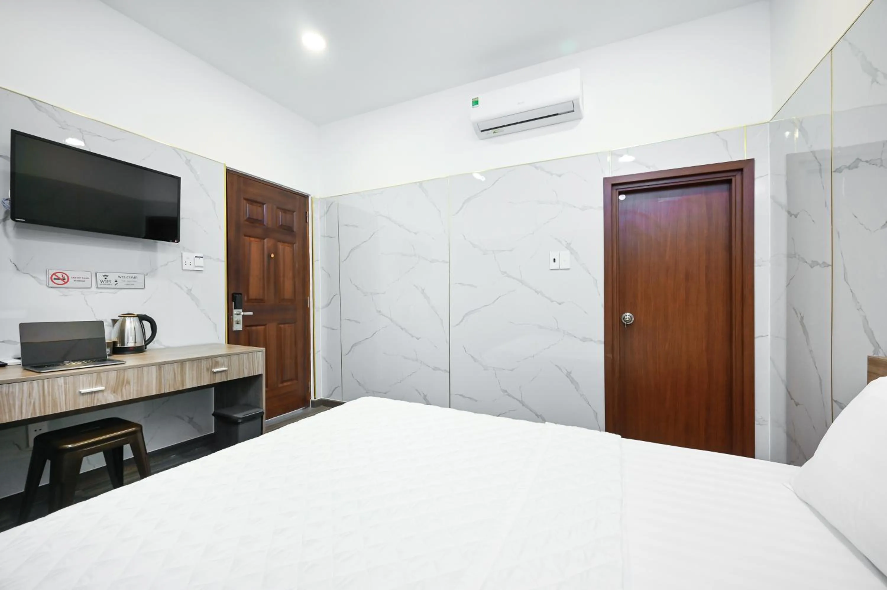 TV and multimedia, Bed in YoKo Airport Saigon Hotel