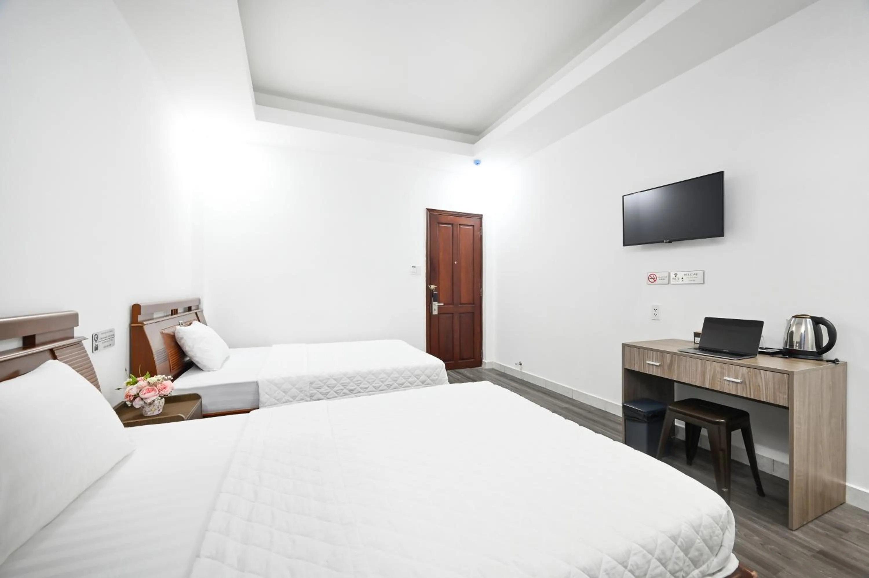 Bed in YoKo Airport Saigon Hotel